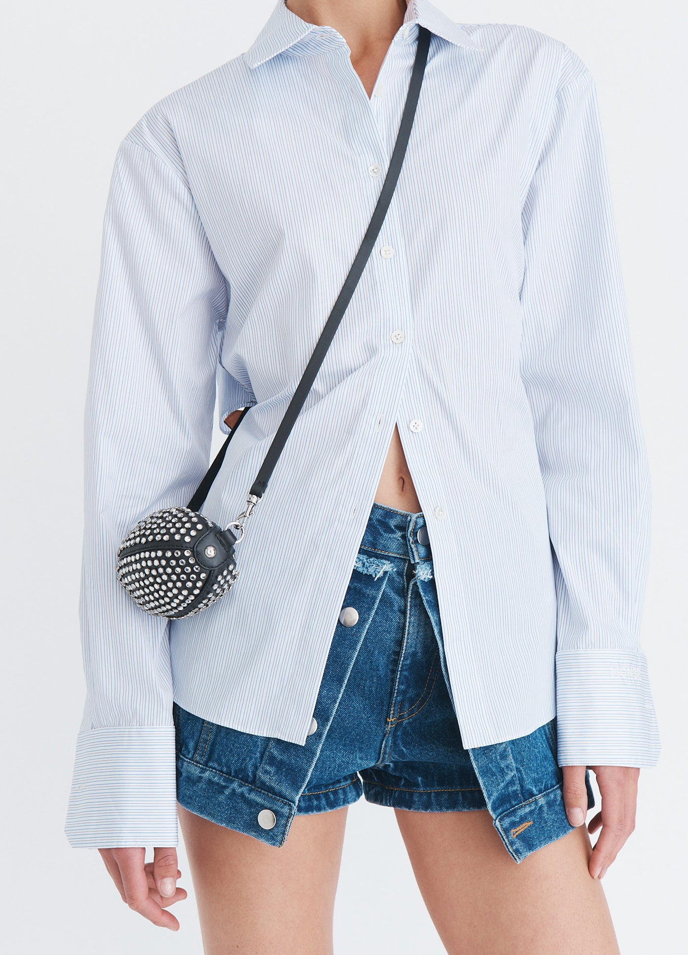 MONSE Baby Football Bag With Crystals in black leather worn as a crossbody bag front detail view