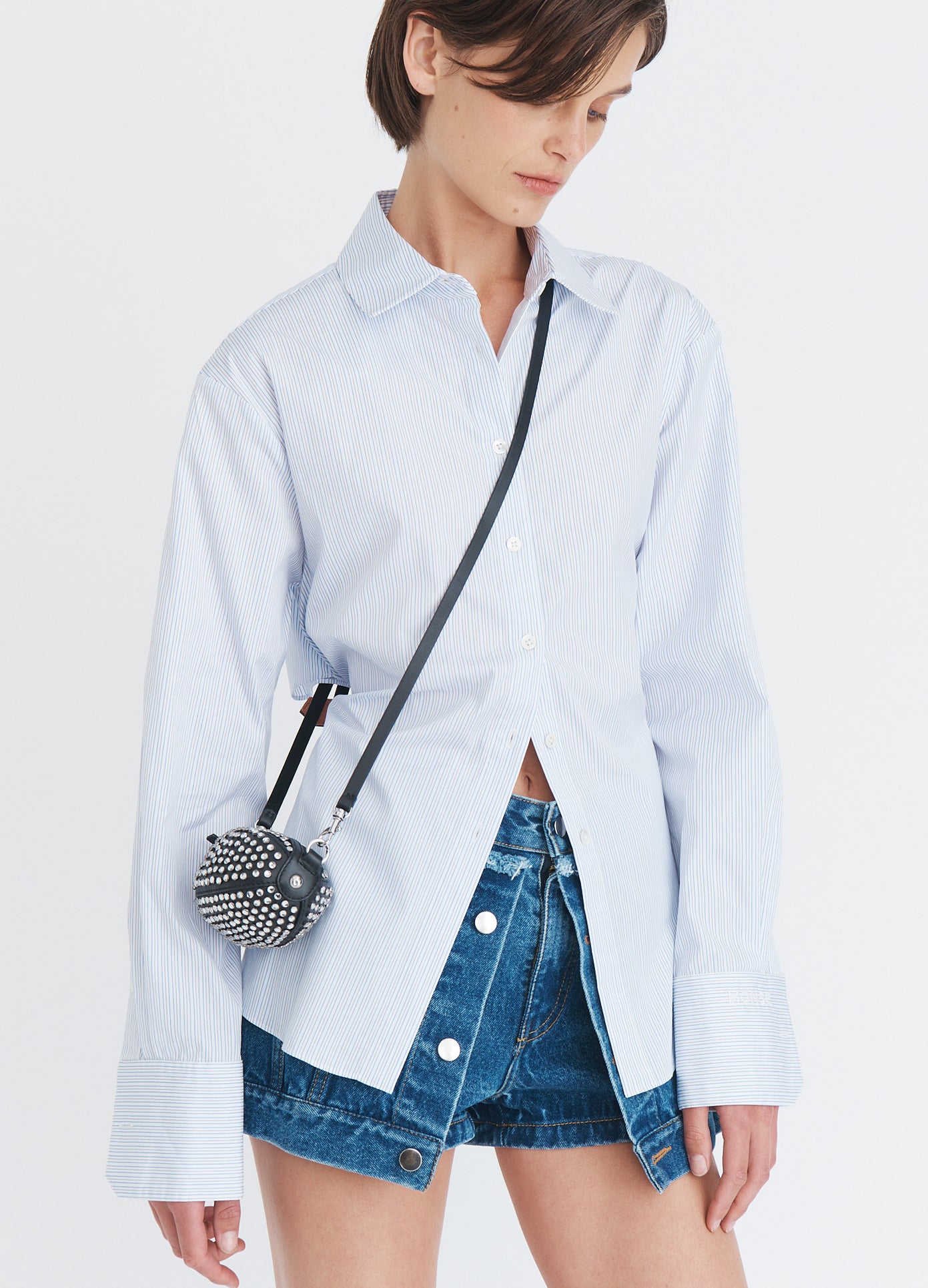 MONSE Baby Football Bag With Crystals in black leather worn as a crossbody bag front view