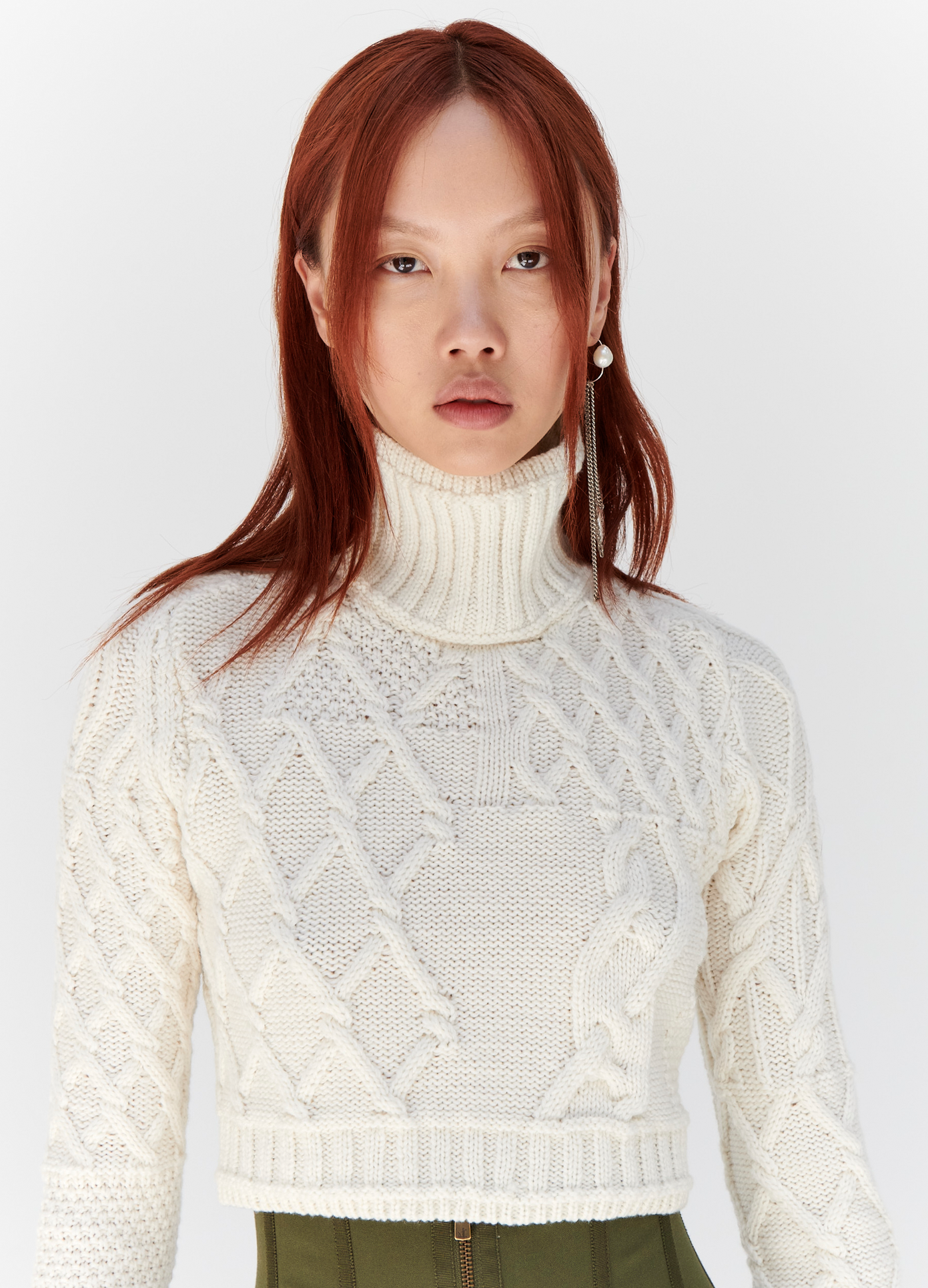 MONSE Cropped Cable Sweater in Ivory on model front detail view
