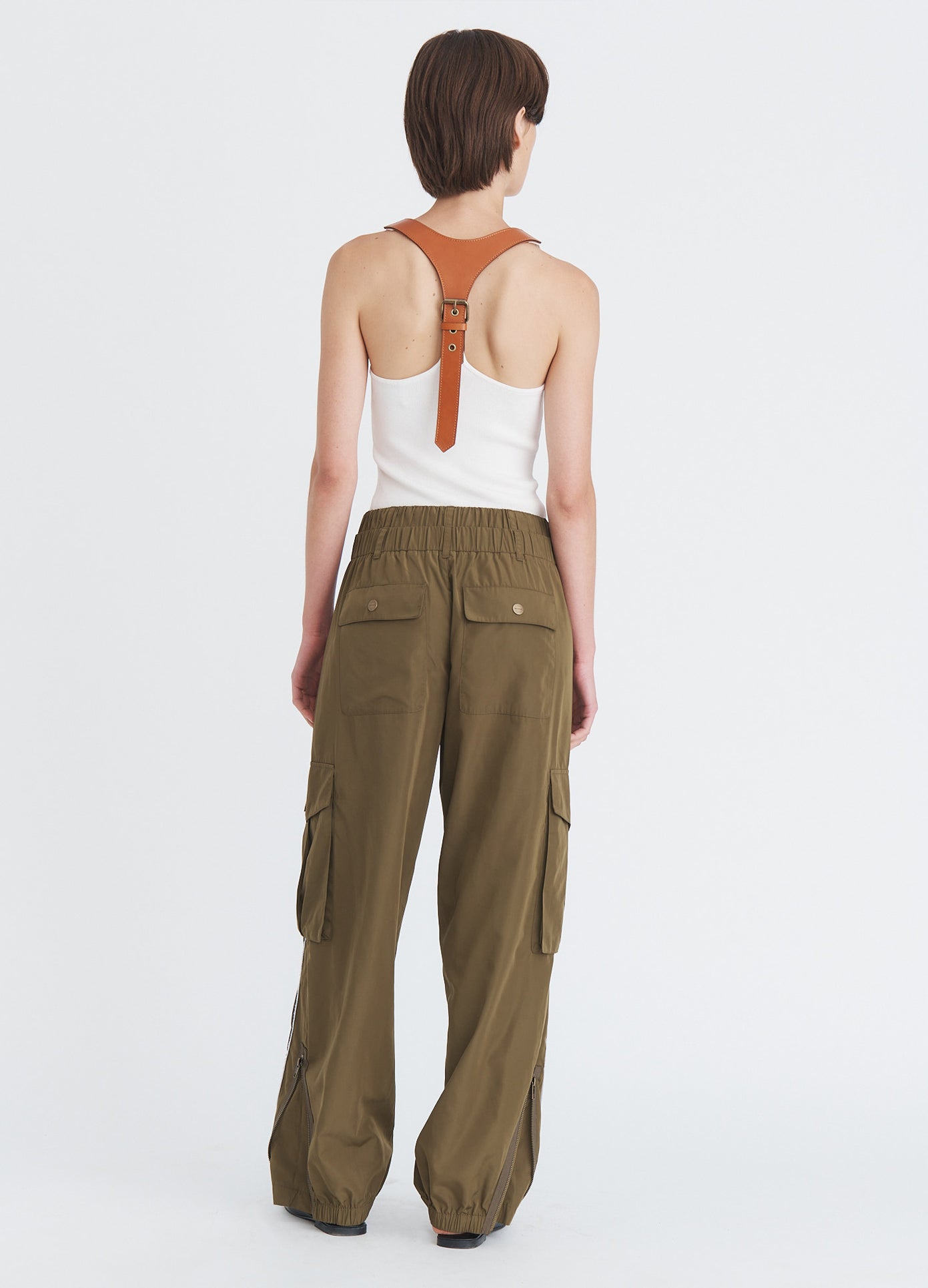 MONSE Deconstructed Combo Pants in olive and dark grey on model full back view
