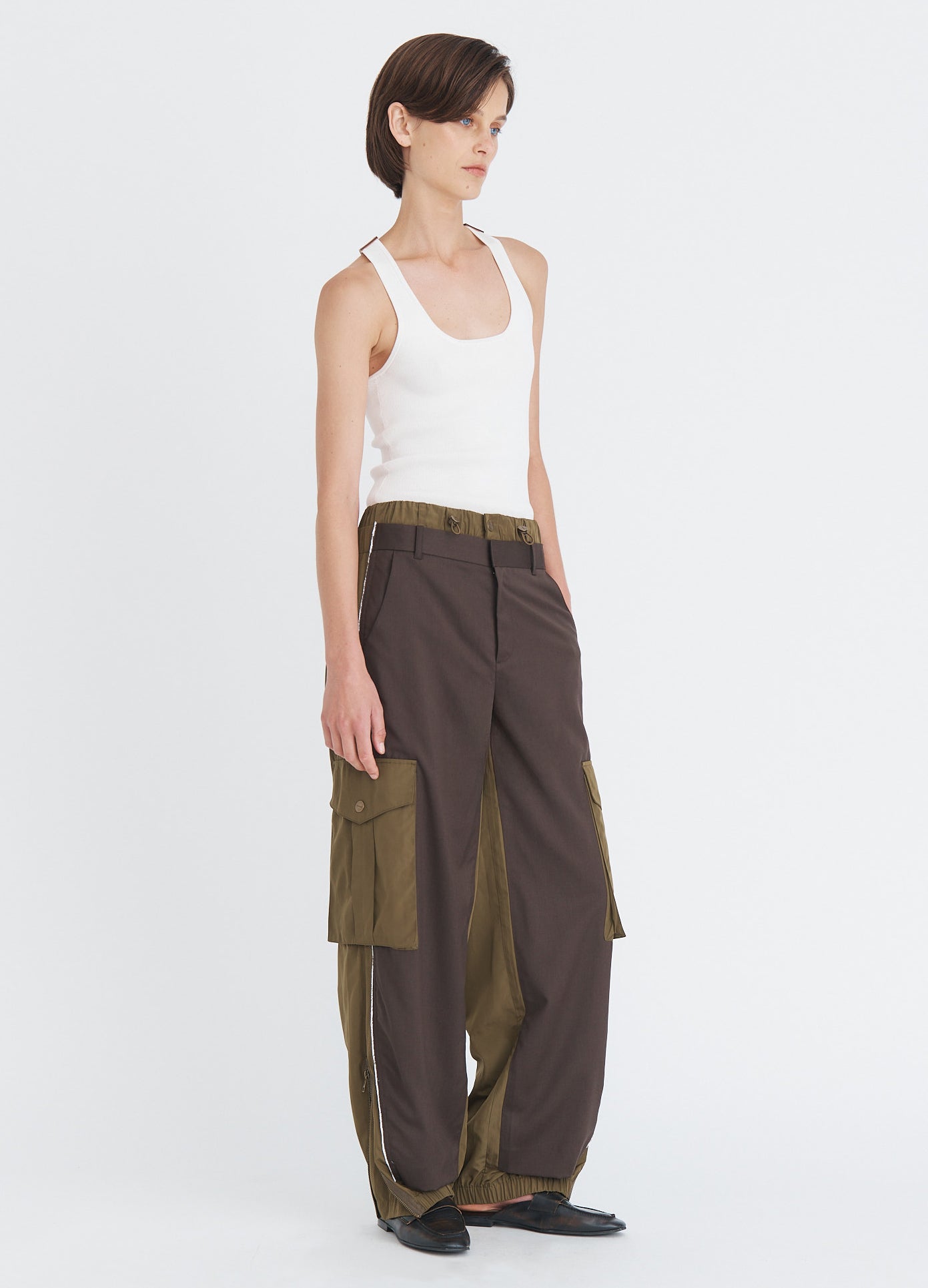 MONSE Deconstructed Combo Pants in olive and dark grey on model full side view