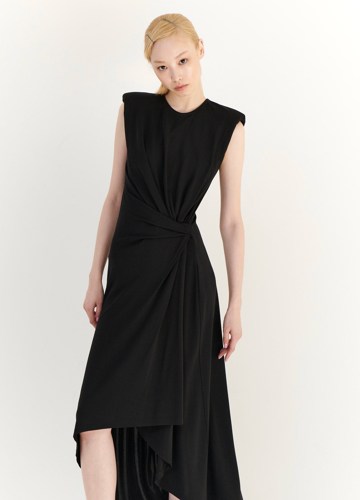MONSE Gathered Power Shoulder Dress in Black on Model With Head Tilted Front View