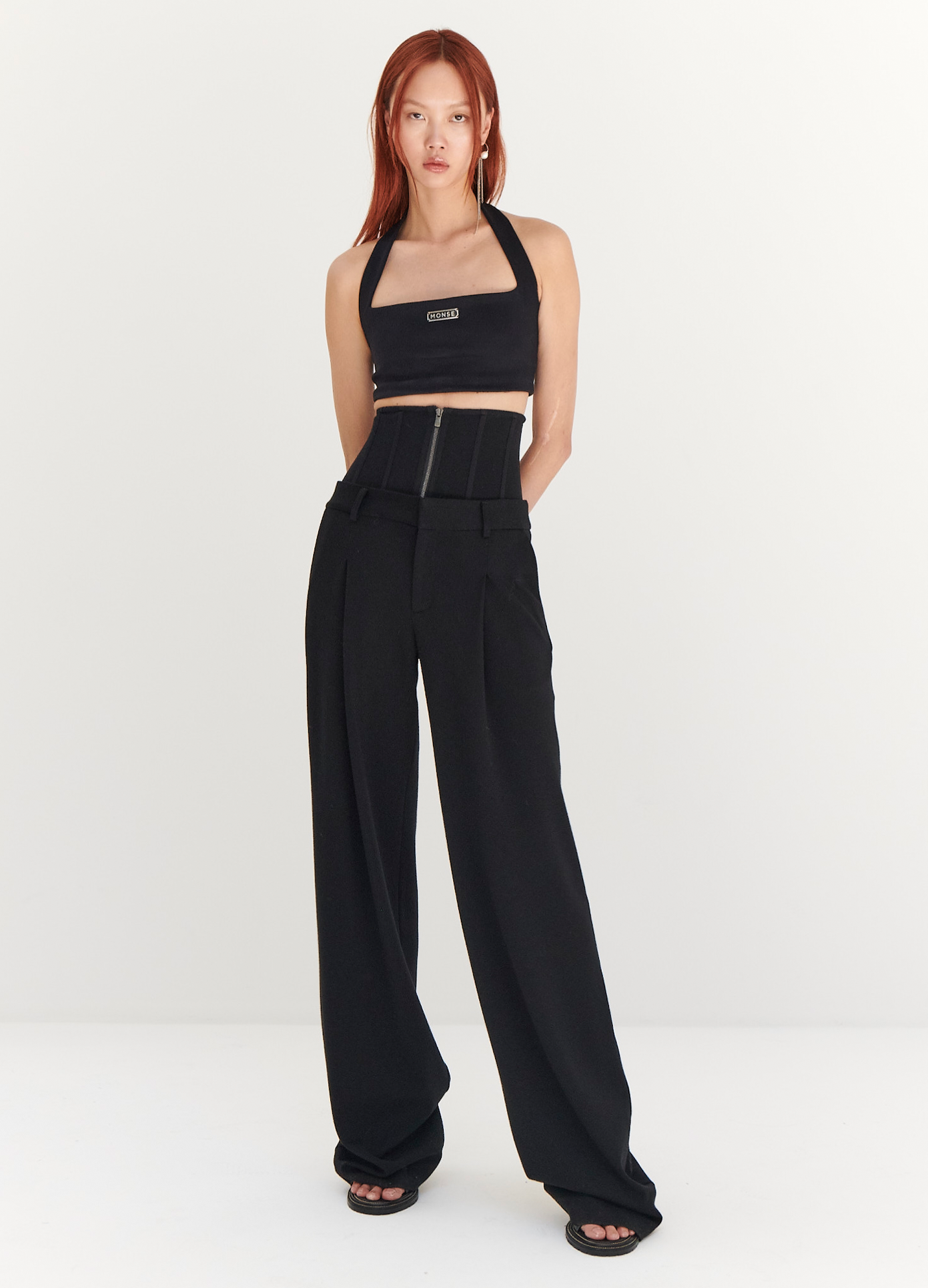 MONSE Jersey Bustier Trousers in Black on model with arms behind back full front view