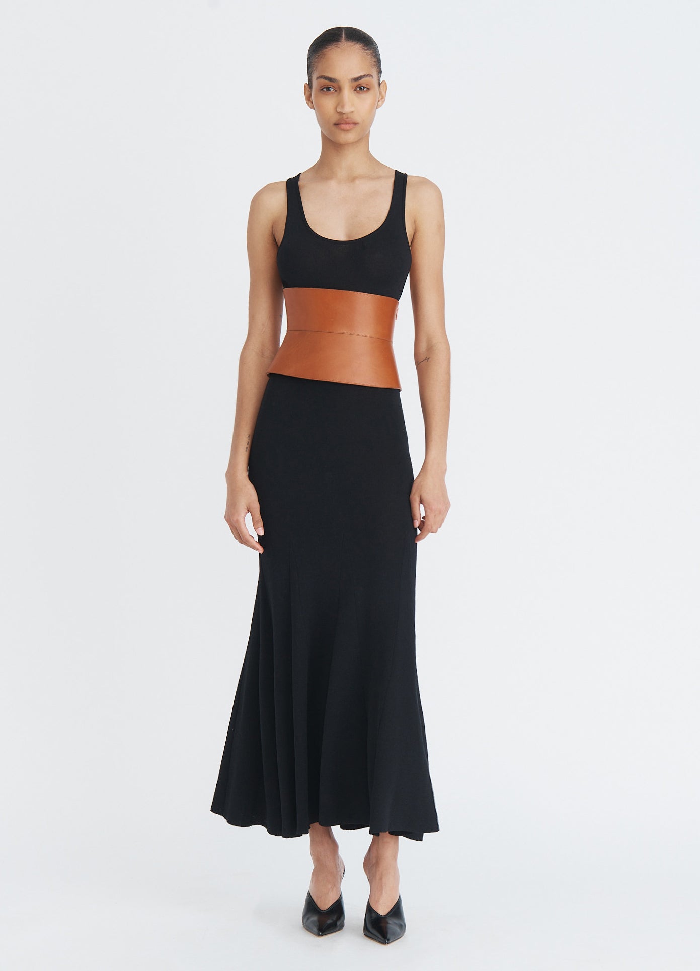 MONSE Leather Racerback Midi Dress in black on model with belt on full front view