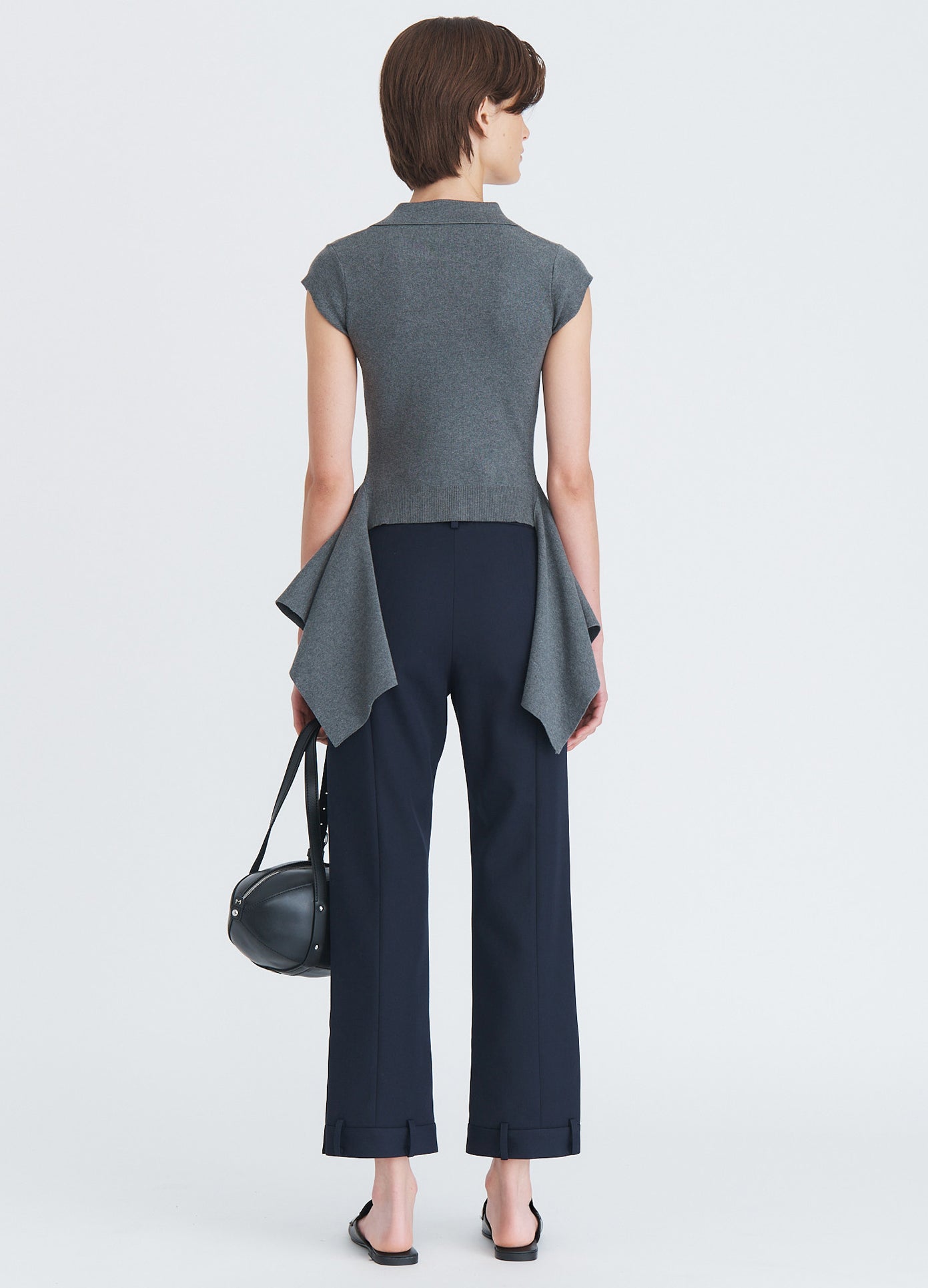 MONSE Napkin Hem Polo Knit Top in charcoal on model full back view