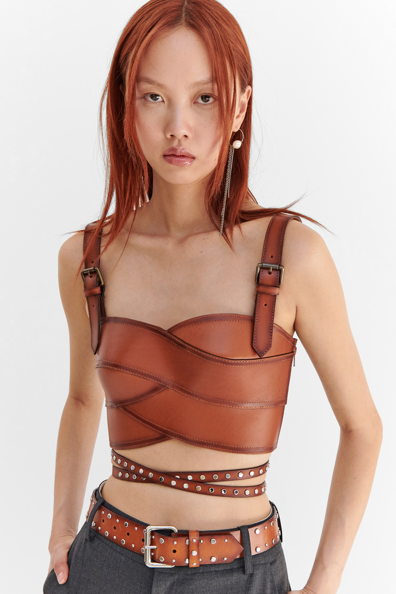 MONSE Resort 2024 Collection Vogue image of model wearing a leather corset bra top