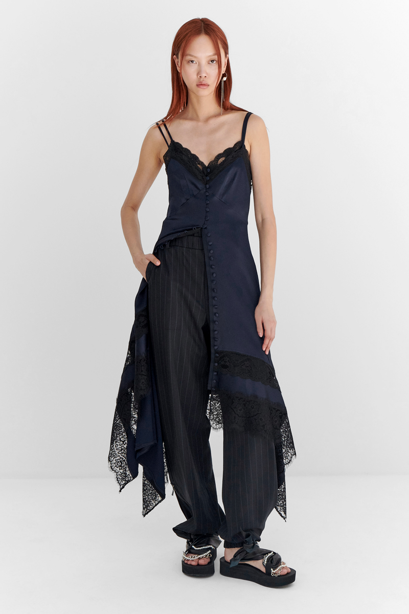 MONSE Resort 2024 Collection Vogue image of model wearing a silk shirt dress
