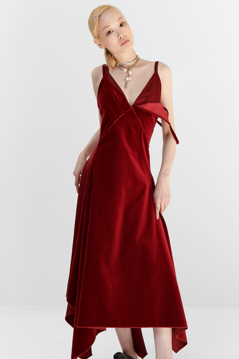 MONSE Resort 2024 Collection Vogue image of model wearing a long red velvet dress