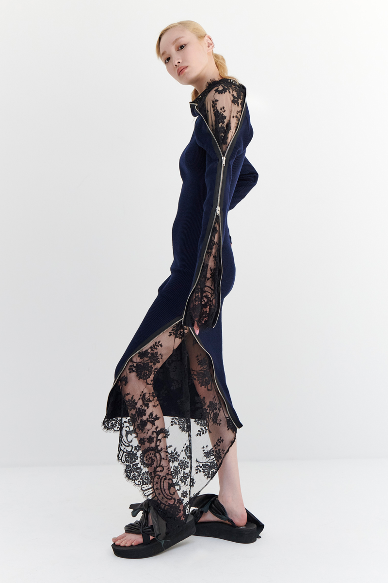 MONSE Resort 2024 Collection Vogue image of model wearing a blue side zipper dress with lace detail