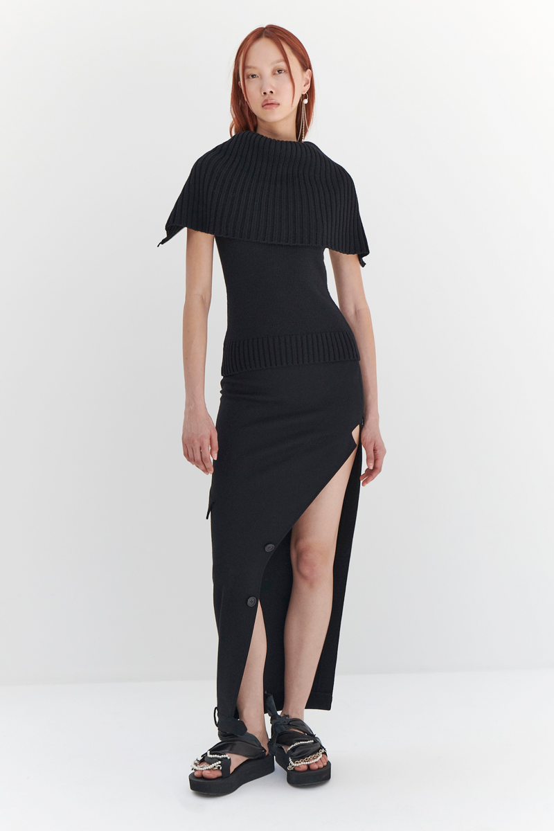 MONSE Resort 2024 Collection Vogue image of model wearing a long sweater dress
