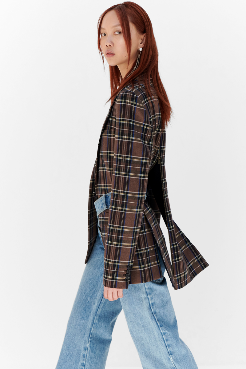 MONSE Resort 2024 Collection Vogue image of model wearing a checkered jacket with jeans