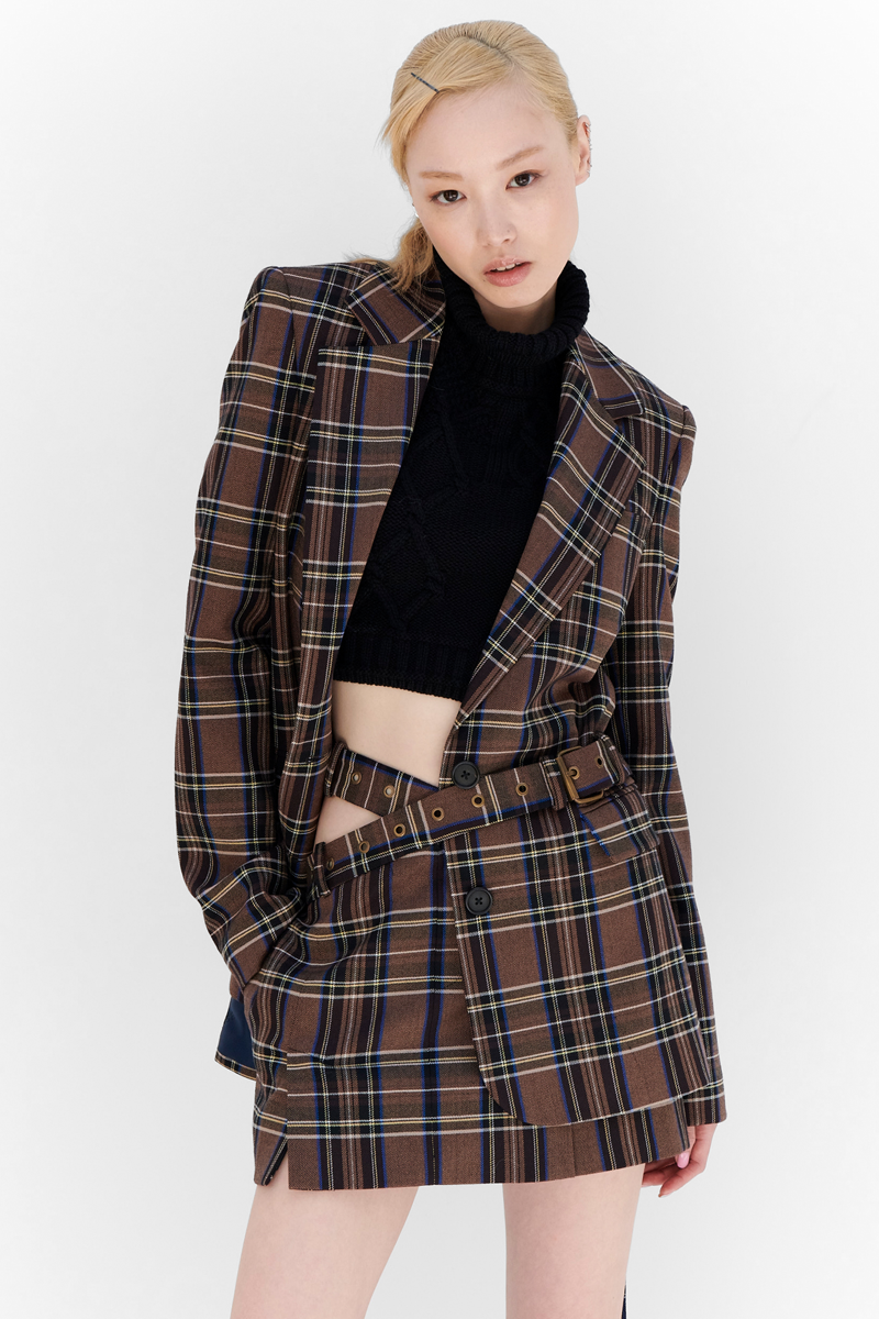 MONSE Resort 2024 Collection Vogue image of model wearing a checkered skirt suit