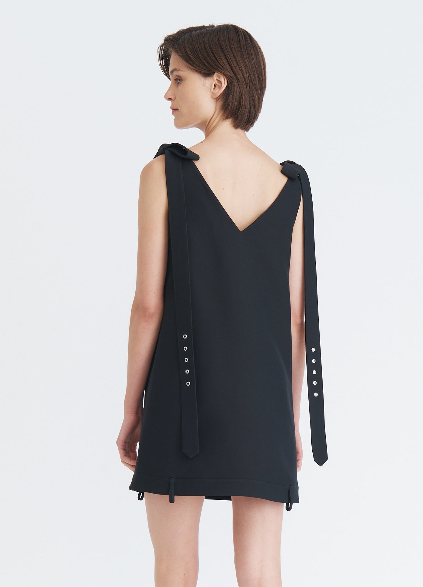 MONSE Shoulder Tie Mini Dress in black on model back view