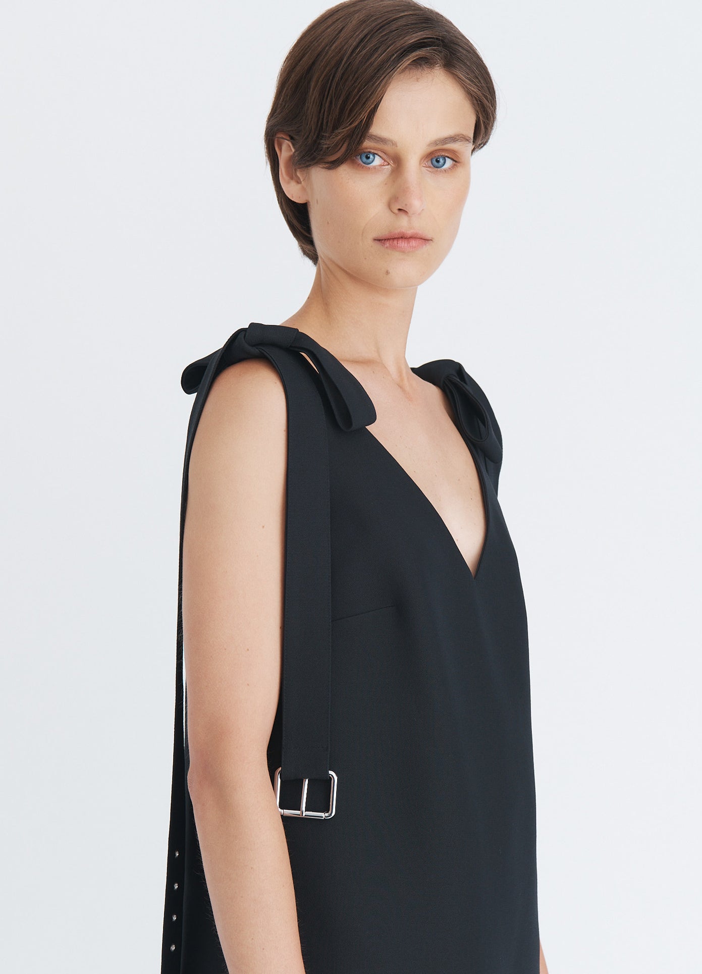 MONSE Shoulder Tie Mini Dress in black on model side view