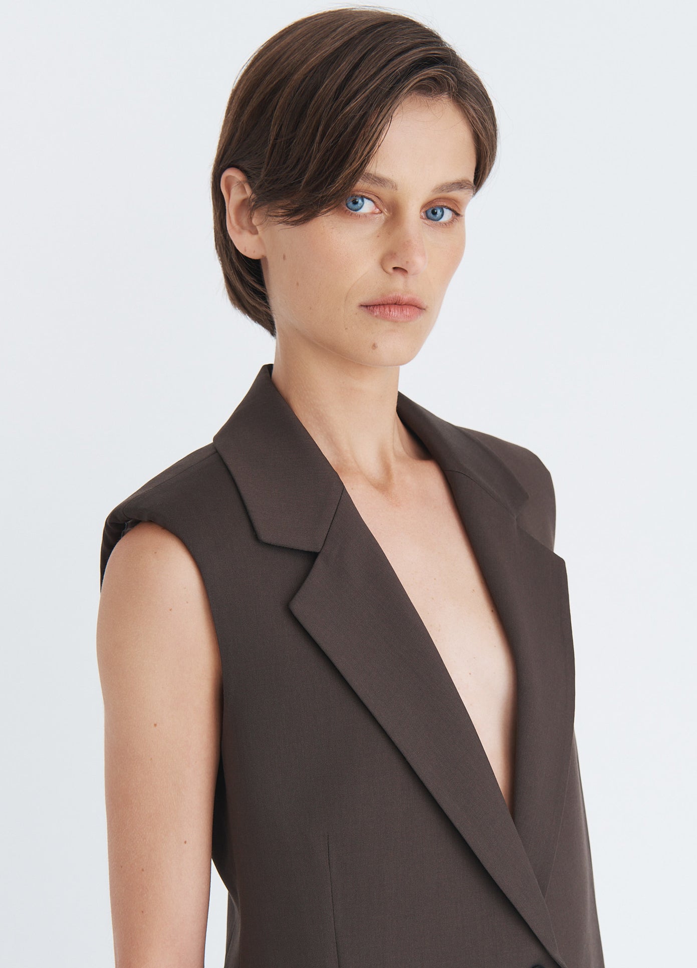 MONSE Sleeveless Fly-Away Jacket in olive brown on model front detail view