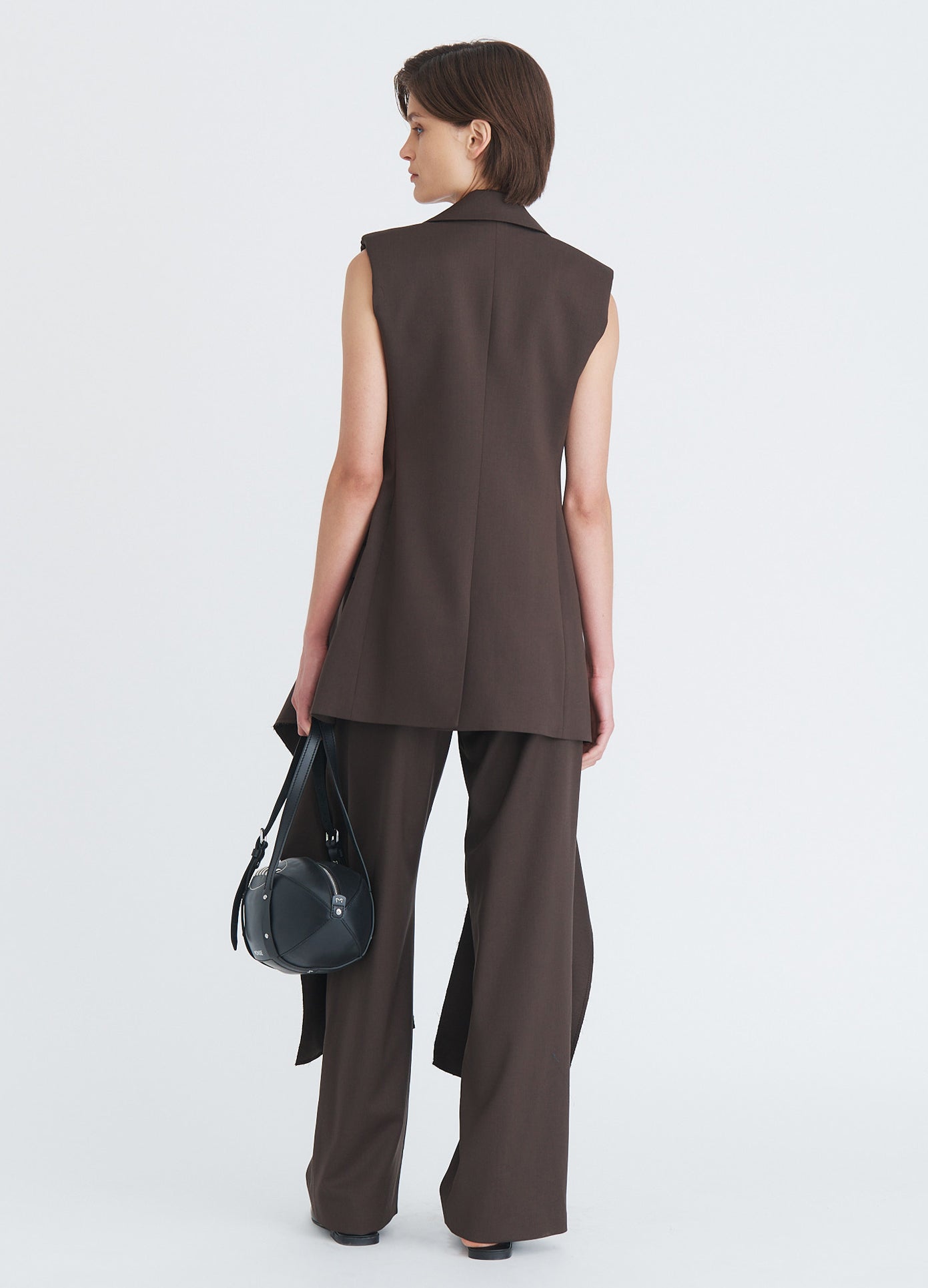 MONSE Sleeveless Fly-Away Jacket in olive brown on model full back view