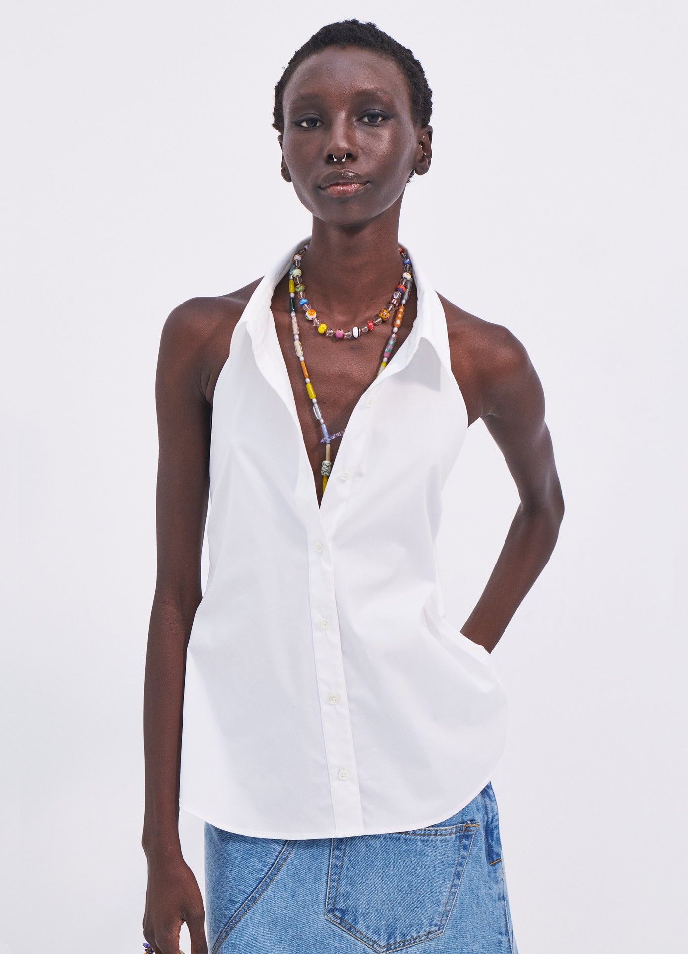 MONSE Sleeveless Halter Back Detail Shirt in White on model front view