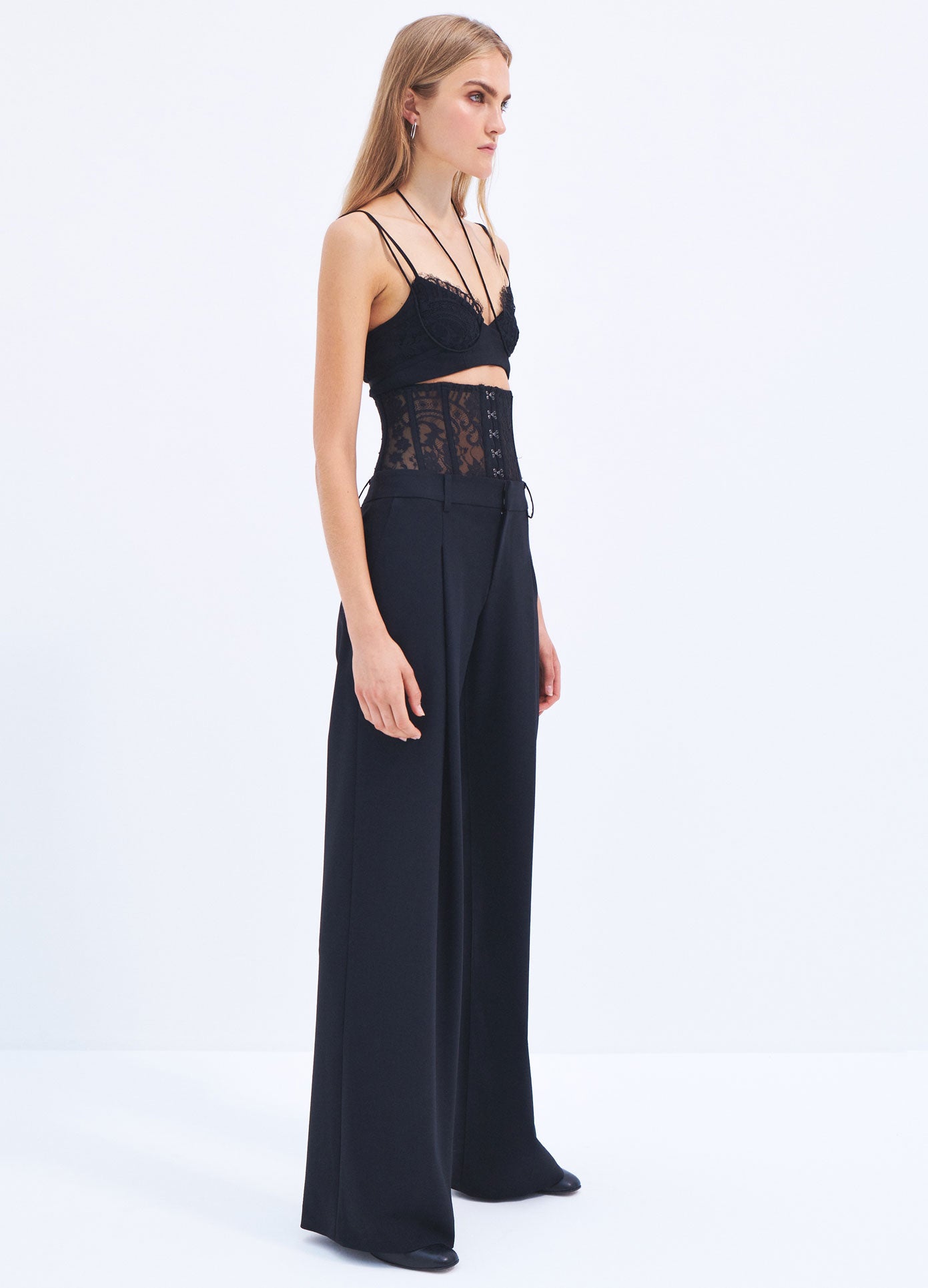 MONSE Spring 2024 Lace Bustier Trousers in Black on model full side view