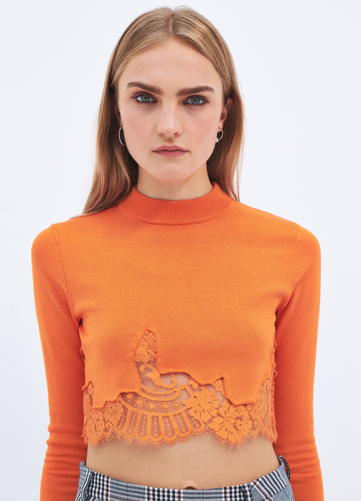 MONSE Spring 2024 Lace Hem Cropped Sweater in Orange on model front detail view