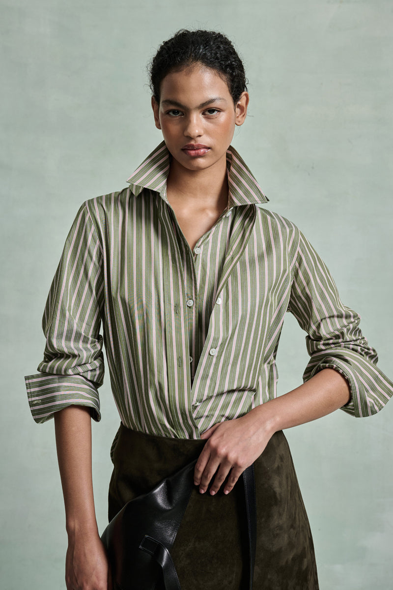MONSE Spring 2026 Collection look 11 woman wearing a striped shirt with a plain background