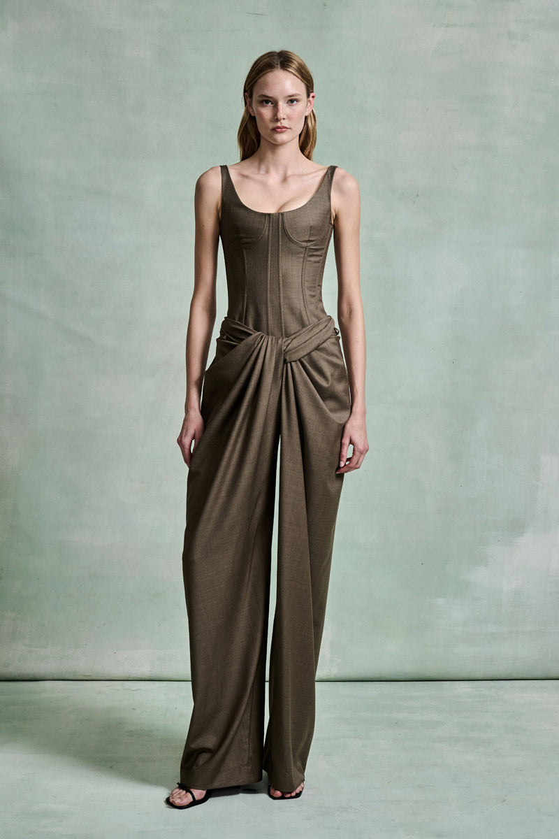 MONSE Spring 2026 Collection look 2 woman wearing a brown jumpsuit against a plain background