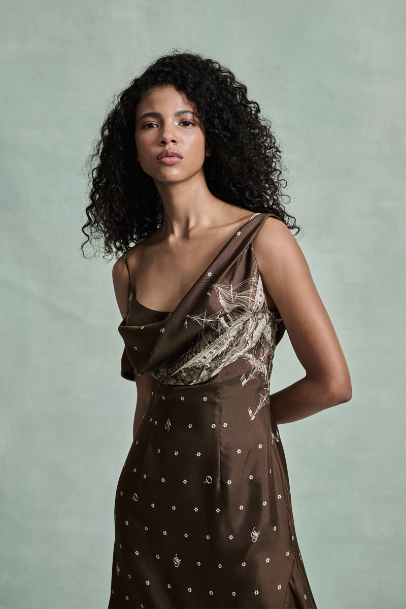 MONSE Spring 2026 Collection look 3 woman wearing a brown dress with a pattern against a plain background