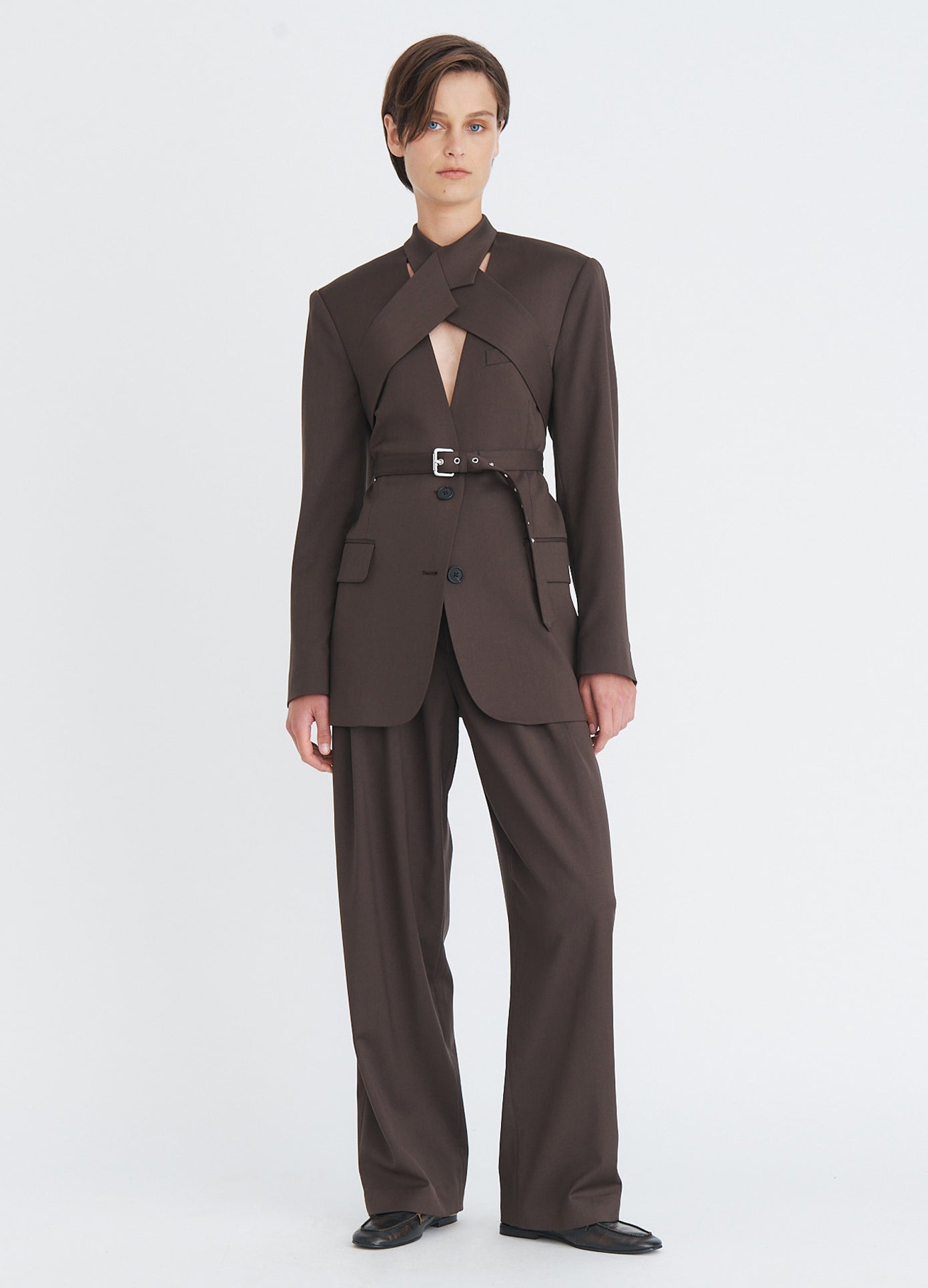 MONSE Tailored Double Waistband Trousers in olive brown on model wearing a full suit