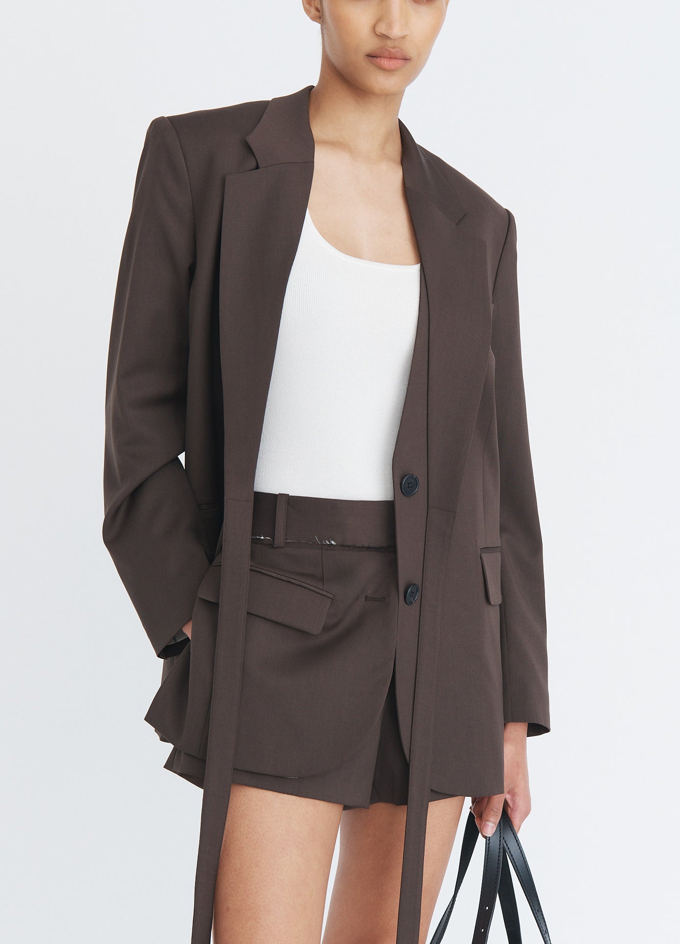 MONSE Tailored Jacket Front Shorts in olive brown on model wearing a matching suit jacket