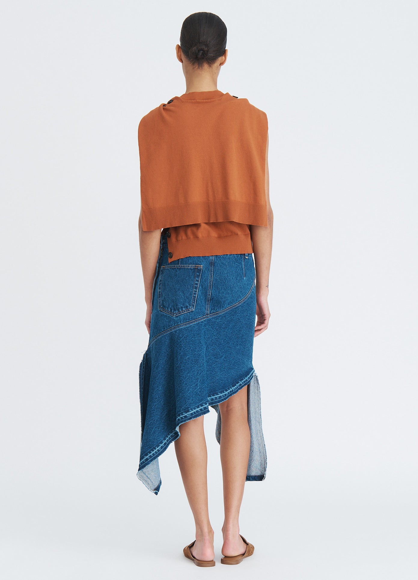 MONSE Twisted Denim Skirt in indigo on model full back view