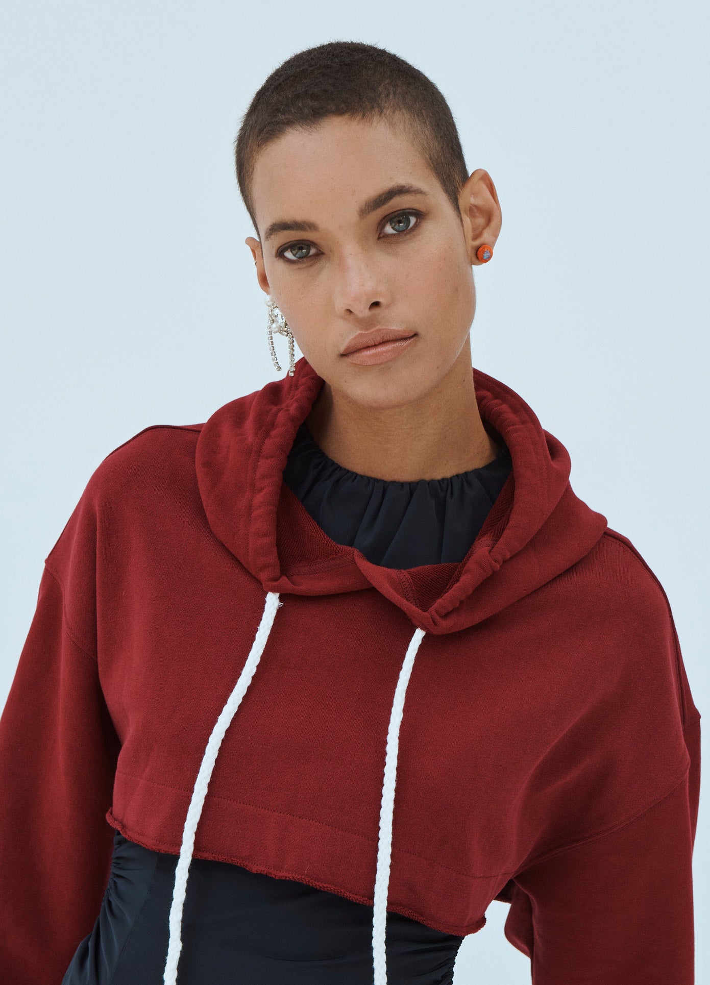 MONSE Cropped Hoodie in Dark Ruby on Model Front Detail View