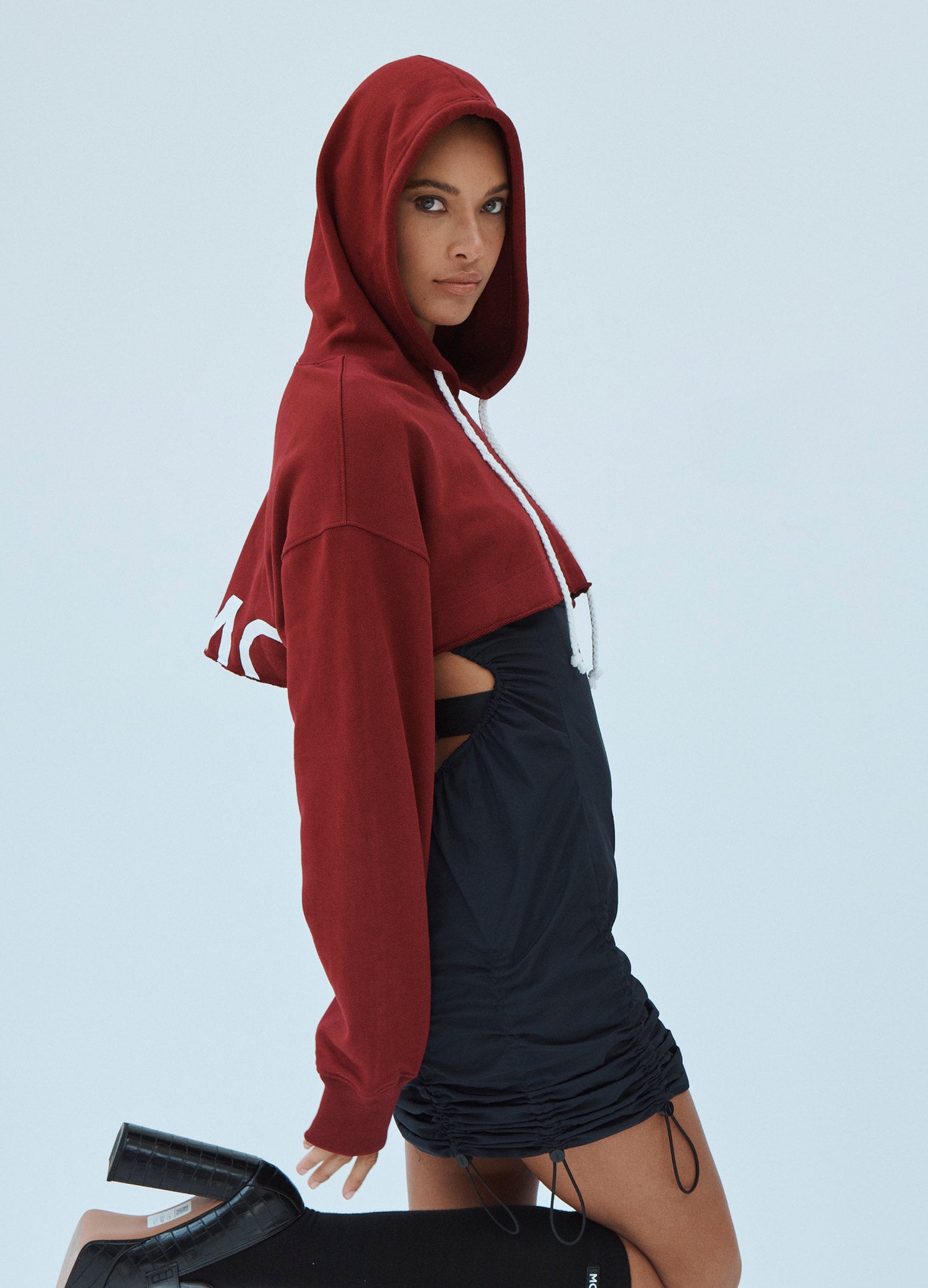 MONSE Cropped Hoodie in Dark Ruby on Model Side Detao;MONSE Cropped Hoodie in Dark Ruby on Model Side Detail View