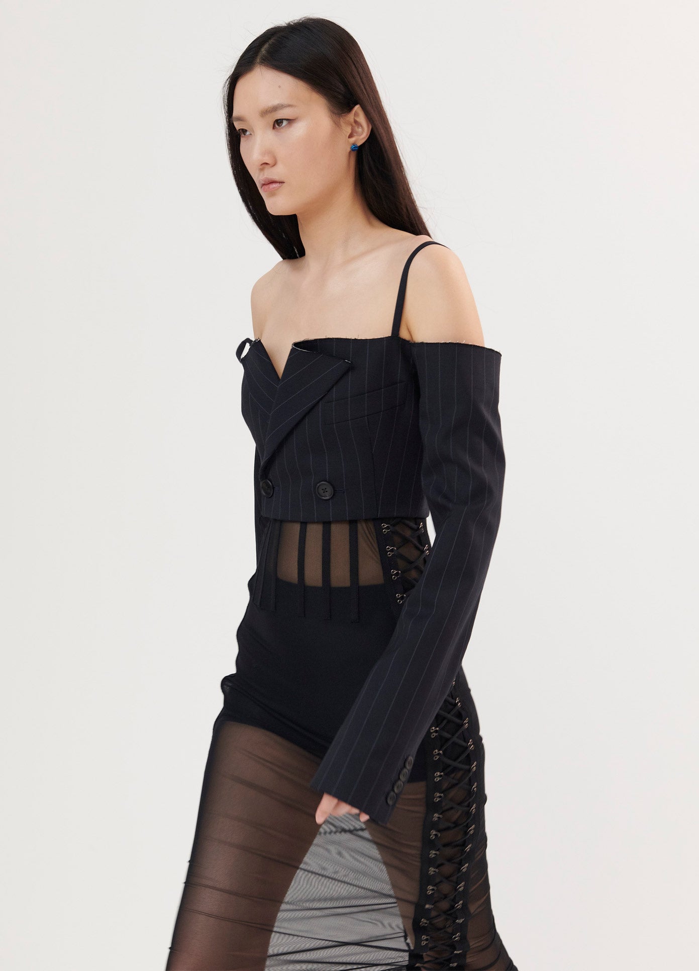 MONSE Off the Shoulder Cropped Jacket in Midnight on Model Walking Left Side View