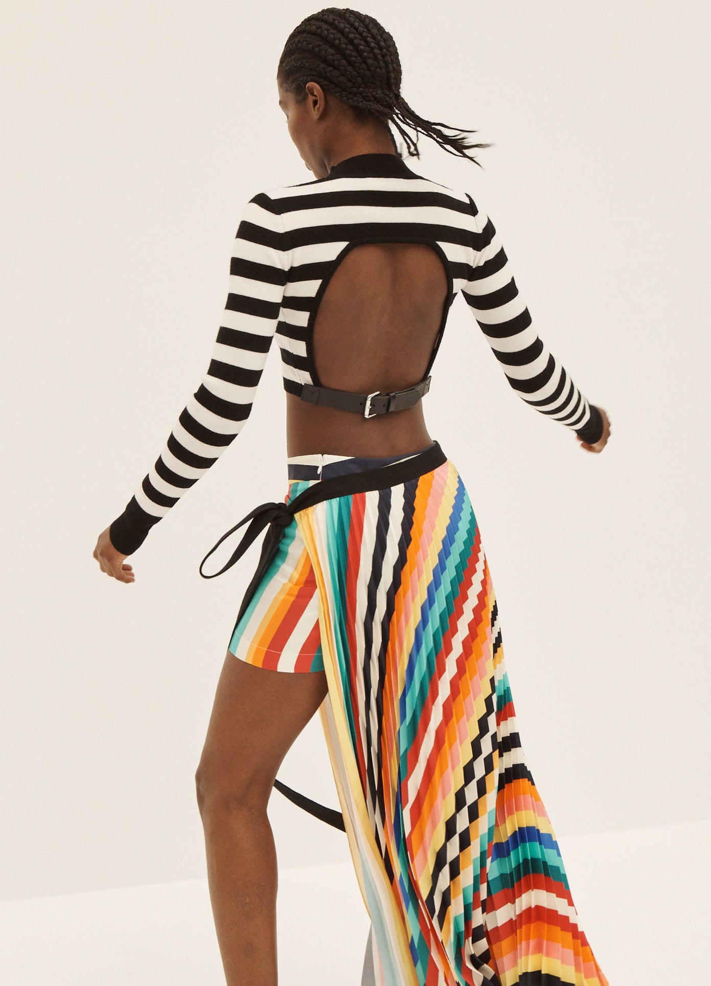 MONSE Rainbow Pleated Shorts in Rainbow on Model Dancing Full Back View