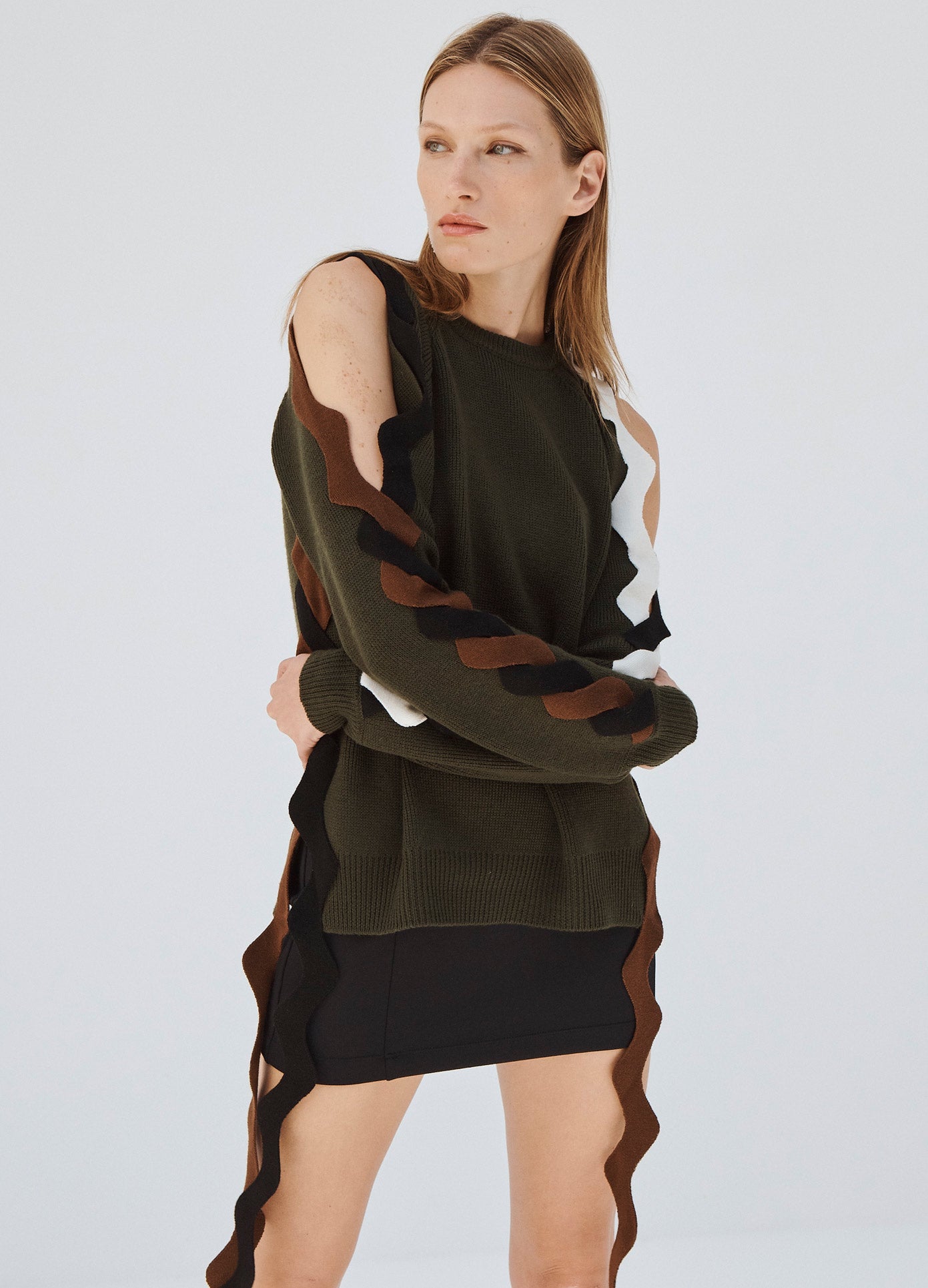 MONSE Ric Rac Sleeve Sweater in Olive on Model with Arms Crossed Front View