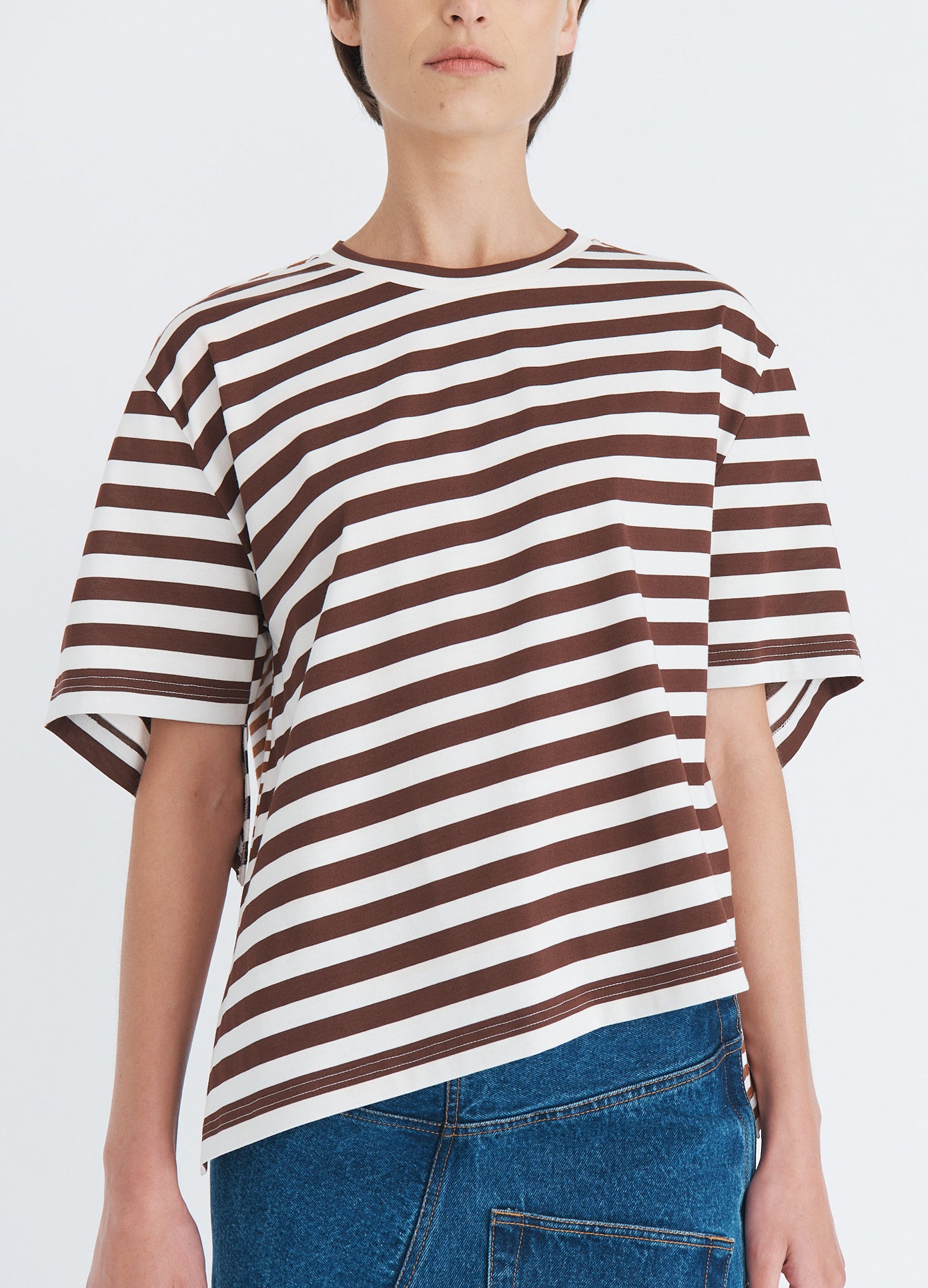 MONSE Asymmetric Twisted T-Shirt in umber on model front detail view