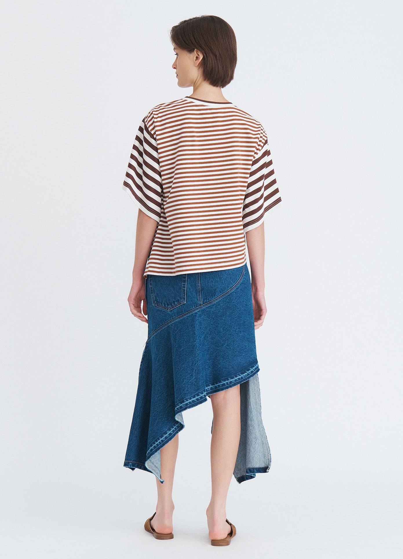 MONSE Asymmetric Twisted T-Shirt in umber on model full back view