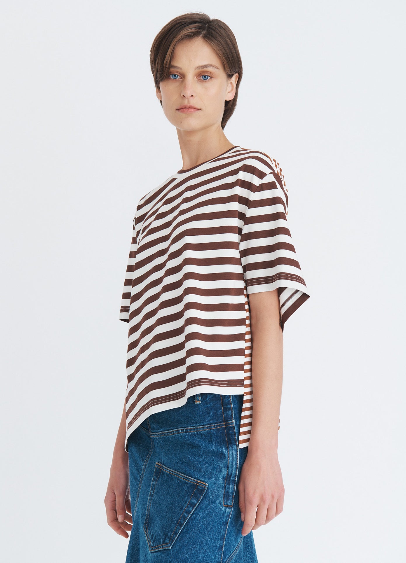 MONSE Asymmetric Twisted T-Shirt in umber on model side view