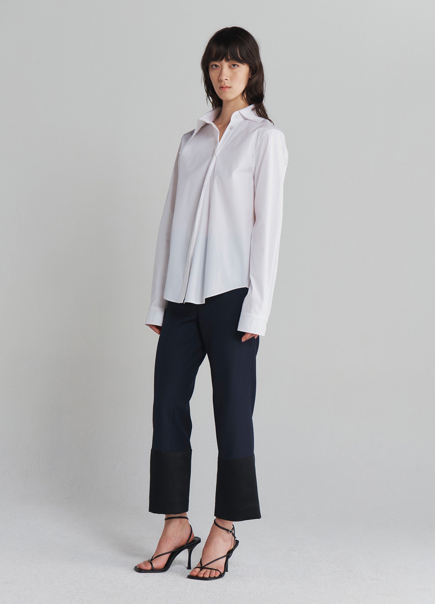 MONSE Asymmetrical Collar Shirt in Ivory on model full side view