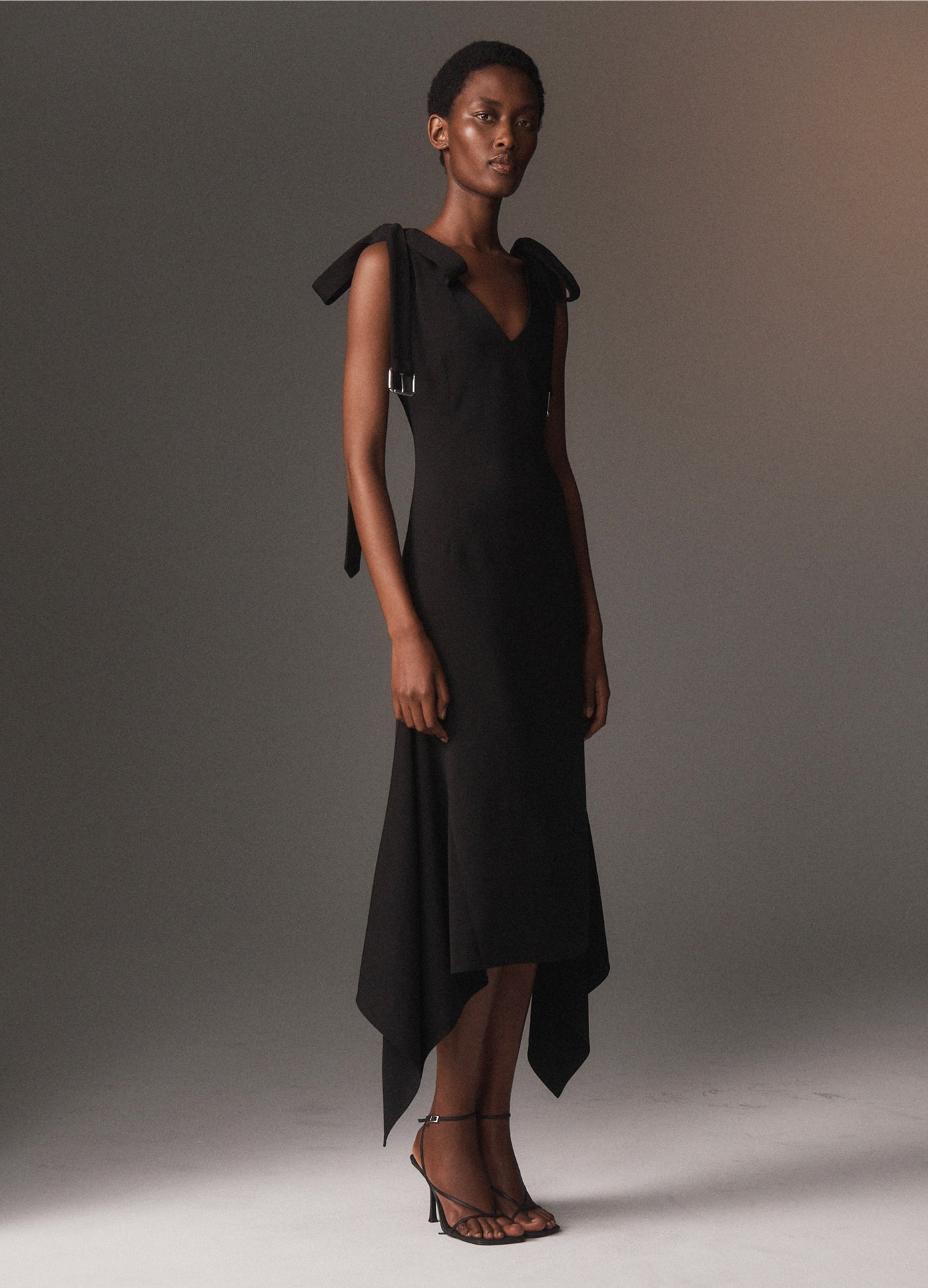 MONSE Buckled Bow Tie Midi Dress in black on model lookbook image
