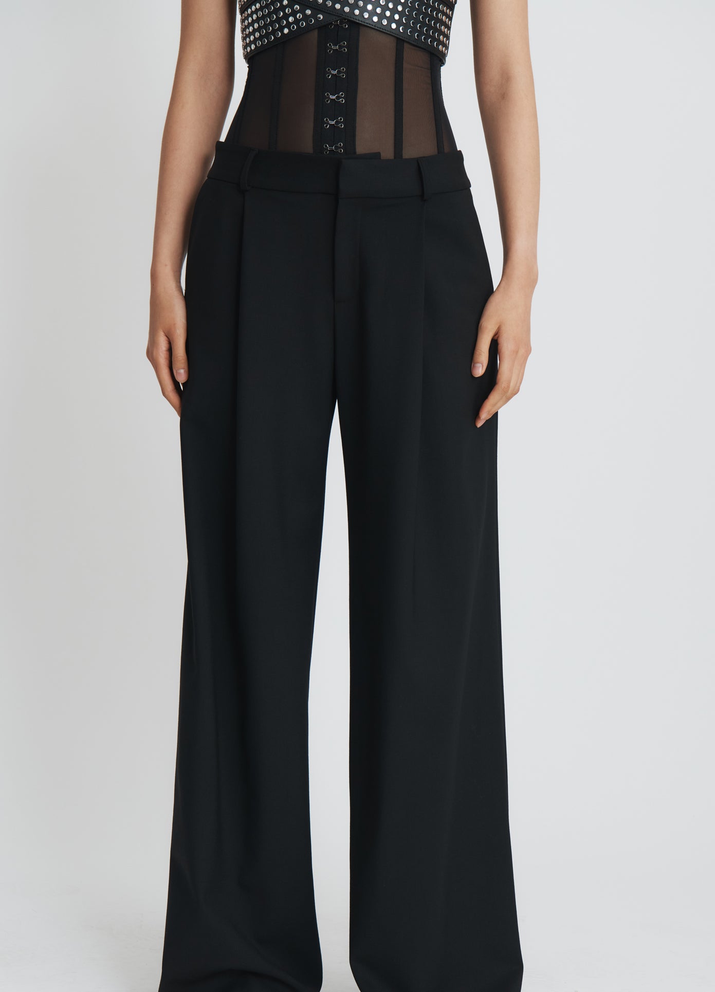 MONSE Bustier Trousers in black on model front bottom view