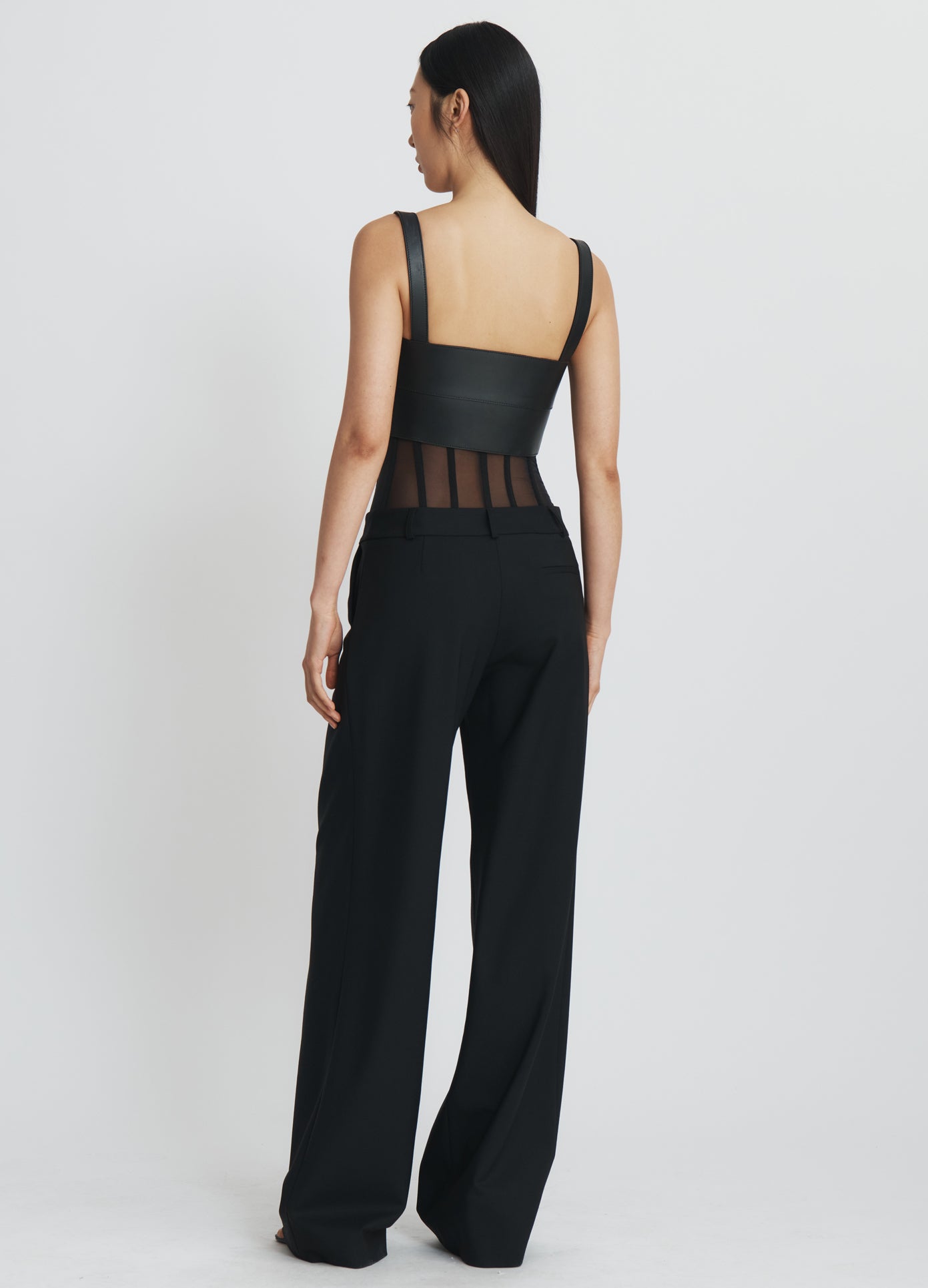 MONSE Bustier Trousers in black on model full back view