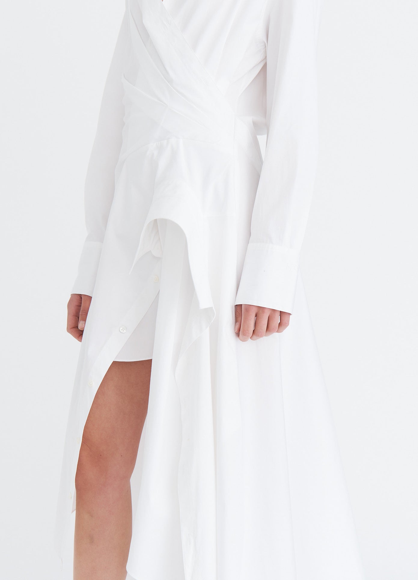 MONSE Cascade Shirt Dress in white on model hem detail view