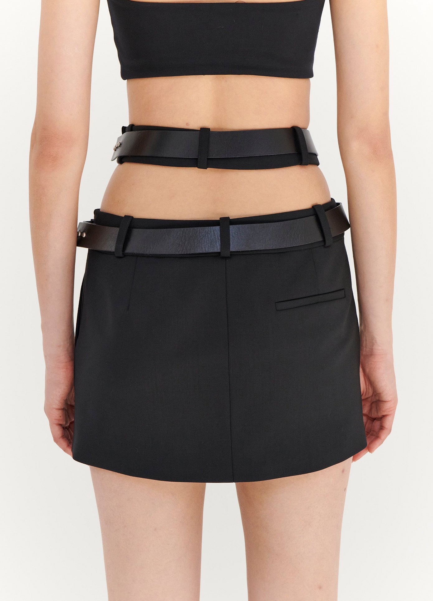 MONSE Criss Cross Waist Belted Mini Skirt in Black on Model Back View