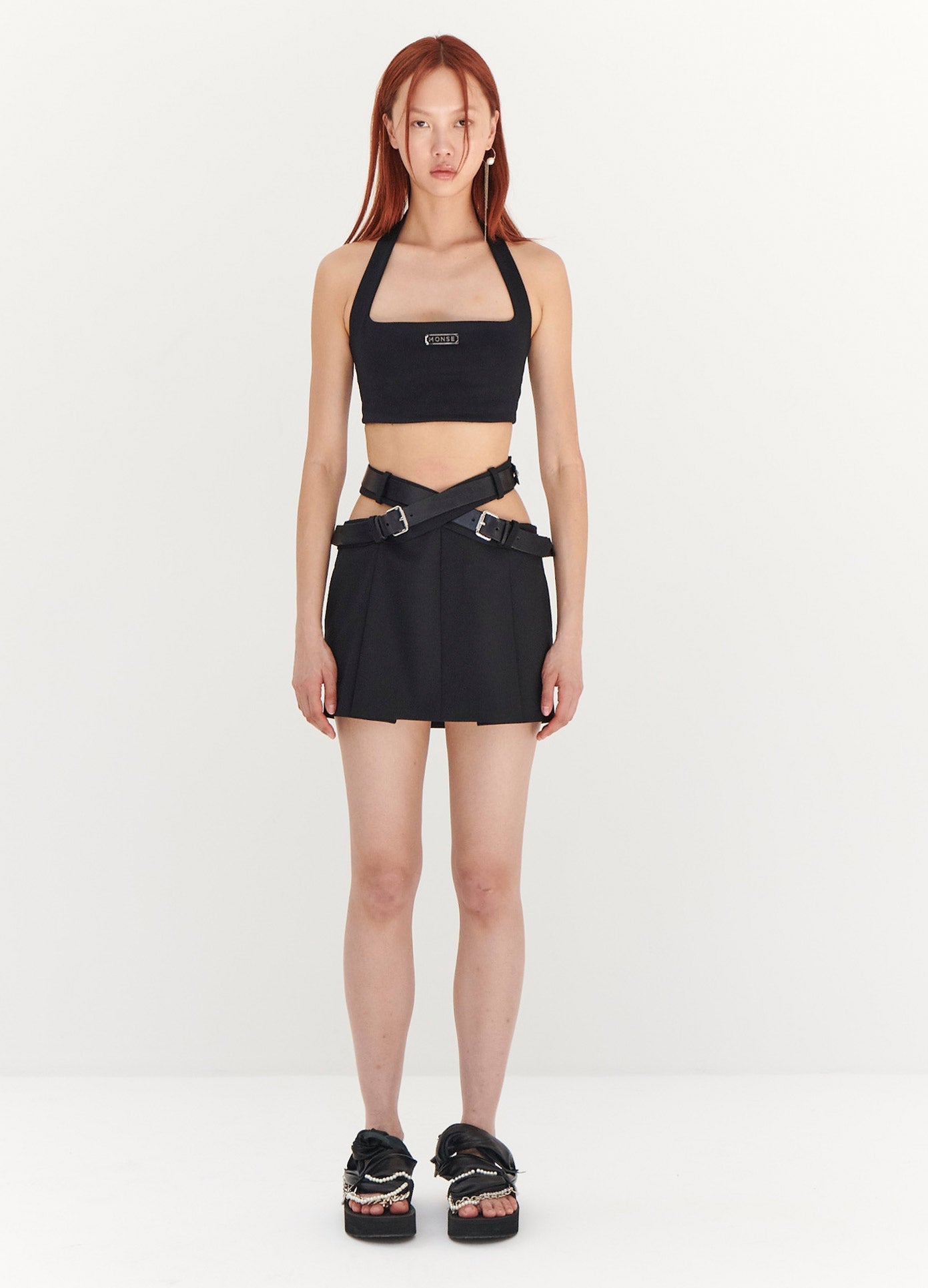 https://monse.com/cdn/shop/files/monse-criss-cross-waist-belted-mini-skirt-in-black-on-model-full-front-view.jpg?v=1686685913