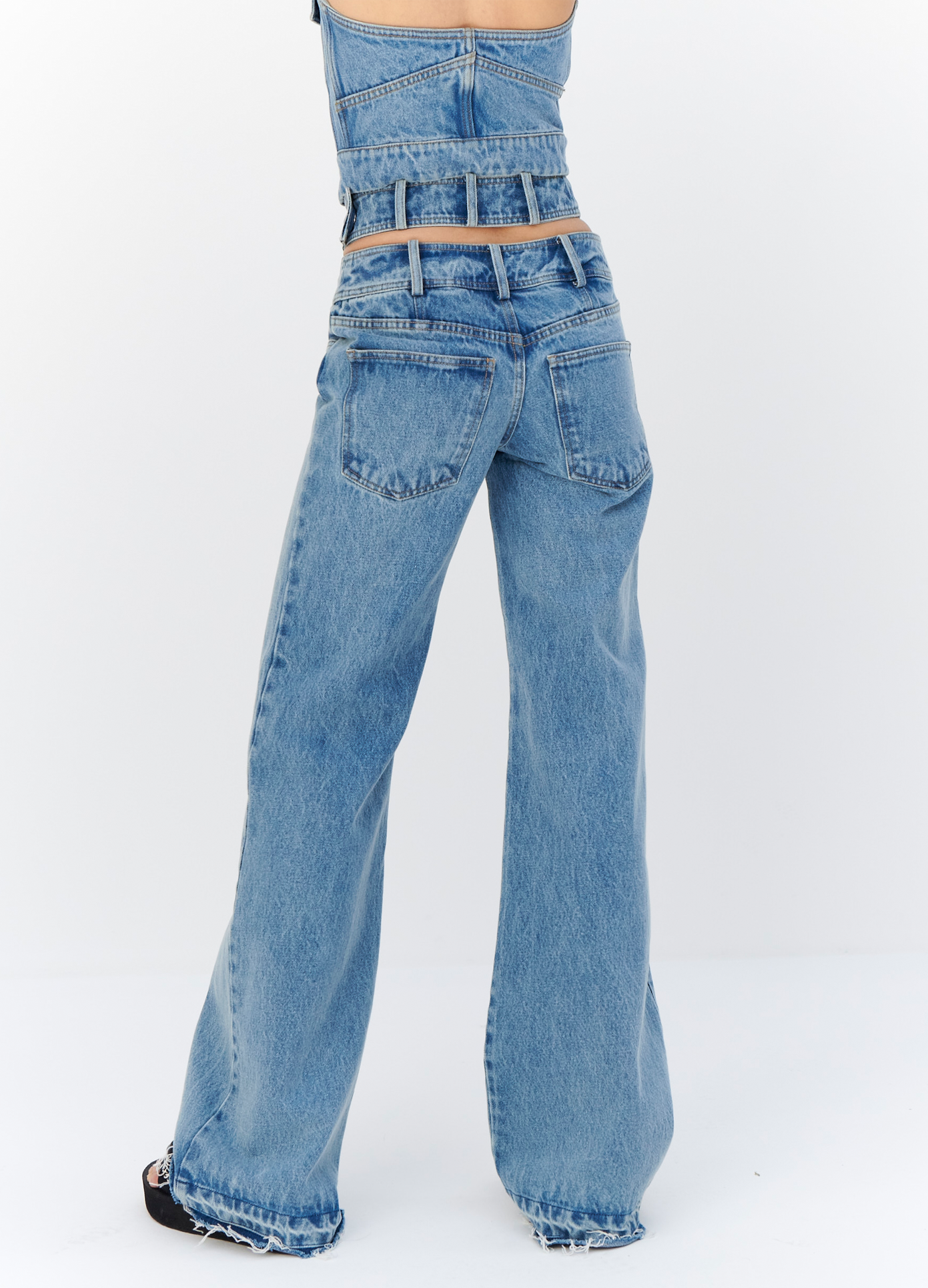 MONSE Criss Cross Waist Jeans in Indigo on model back detail view
