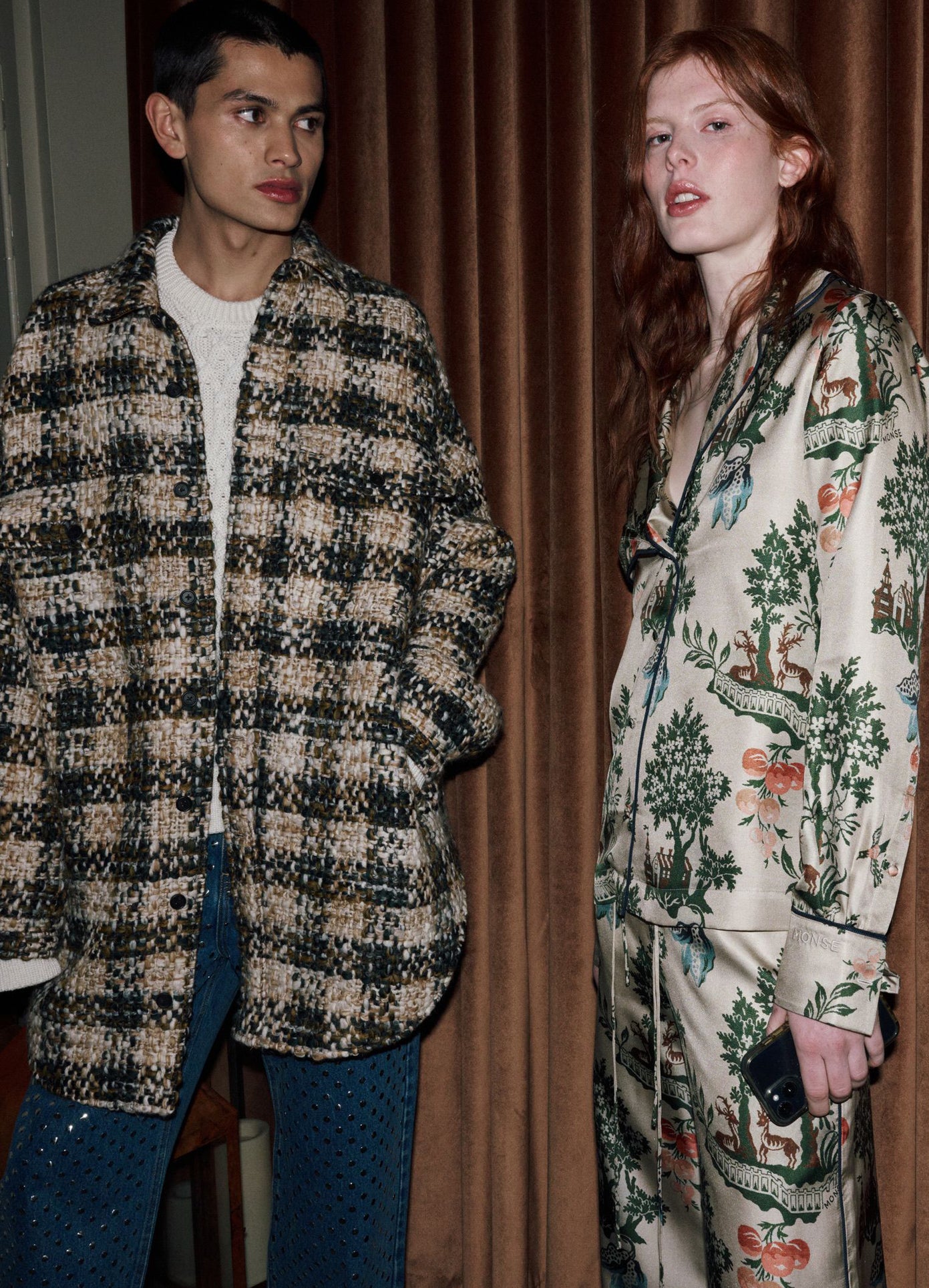 MONSE Deconstructed Pajama Top in burgundy and white on model standing backstage