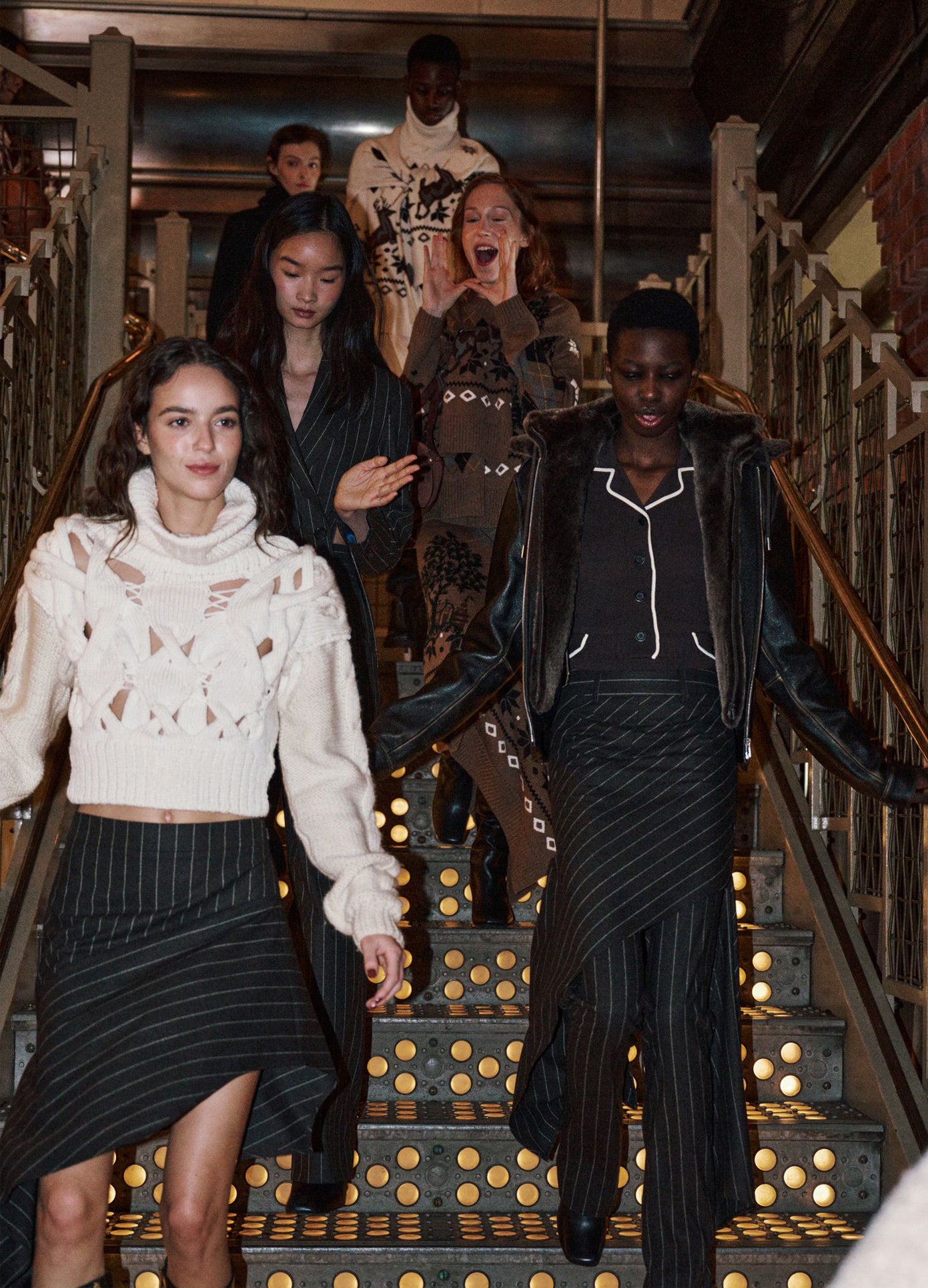 MONSE Deconstructed Pajamas Skirt in brown on runway model walking down stairs