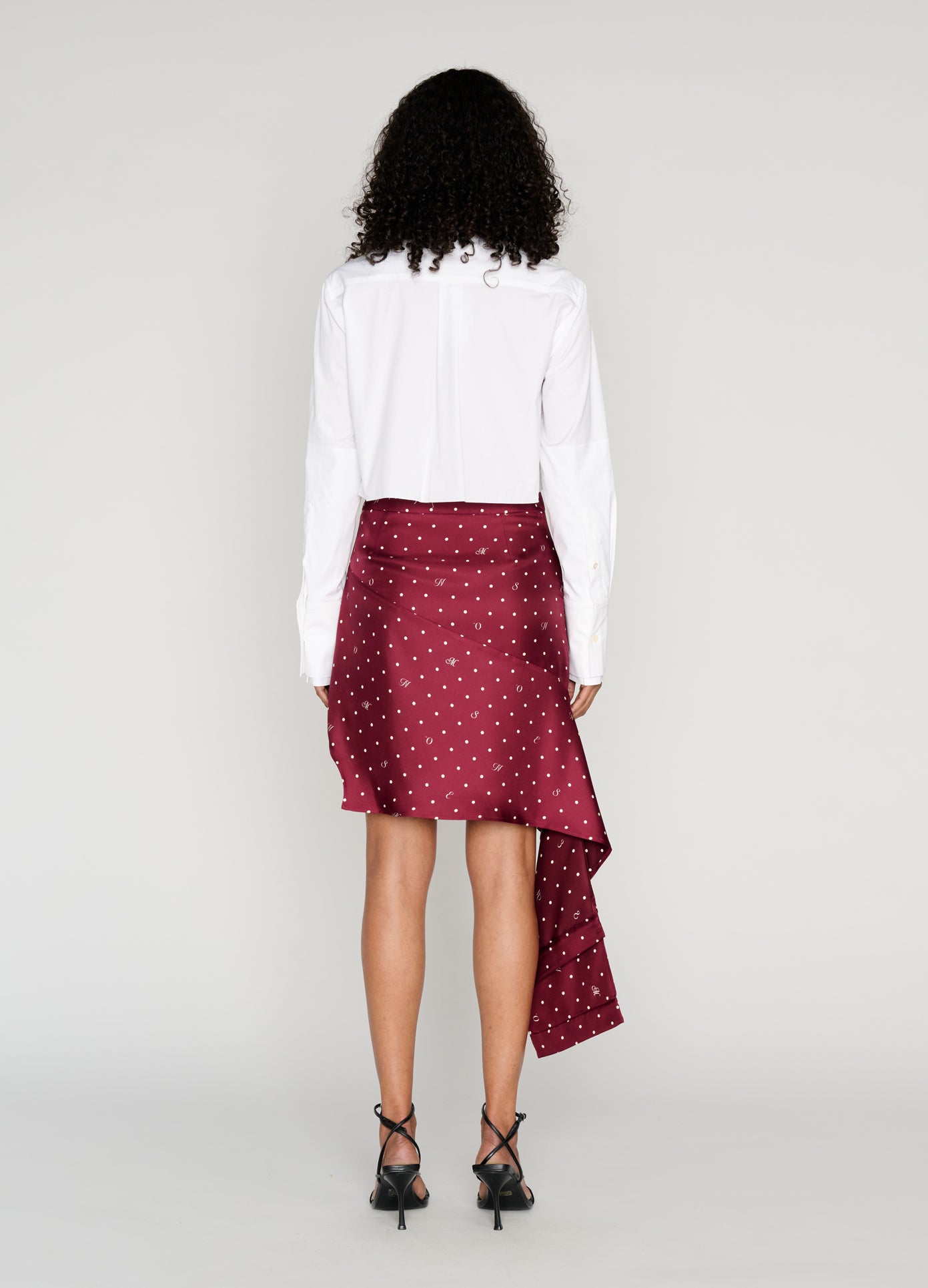 MONSE Deconstructed Pajamas Skirt in burgundy on model full back view
