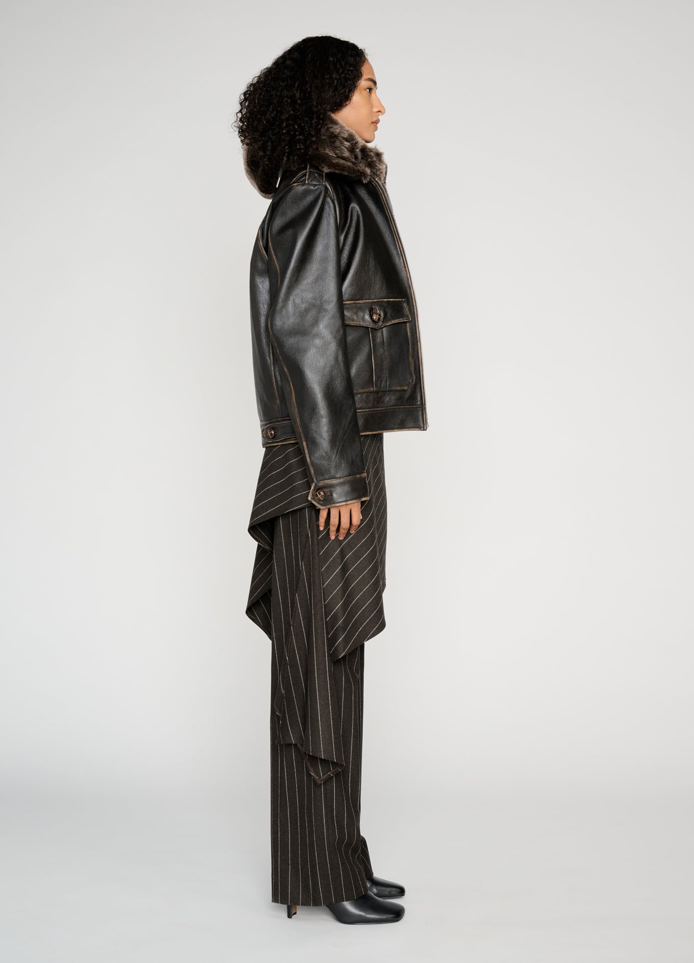 MONSE Deconstructed Tailored Skirt Trousers in brown on model full side view