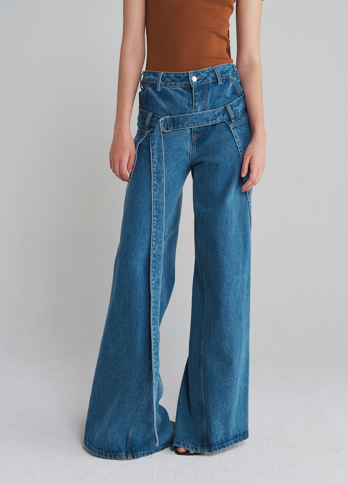 MONSE Deconstructed Wrap Denim Jeans in Indigo on model front bottom view